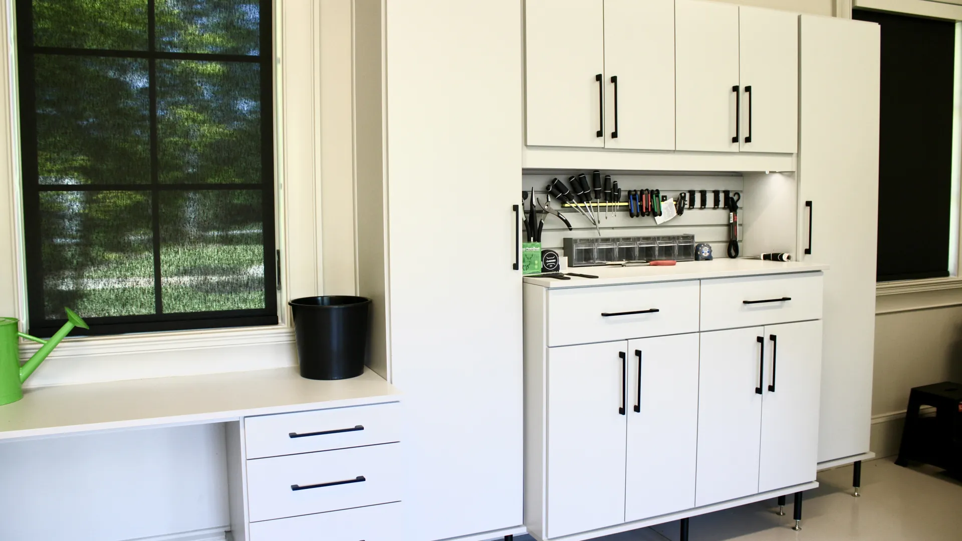 a kitchen with white cabinets