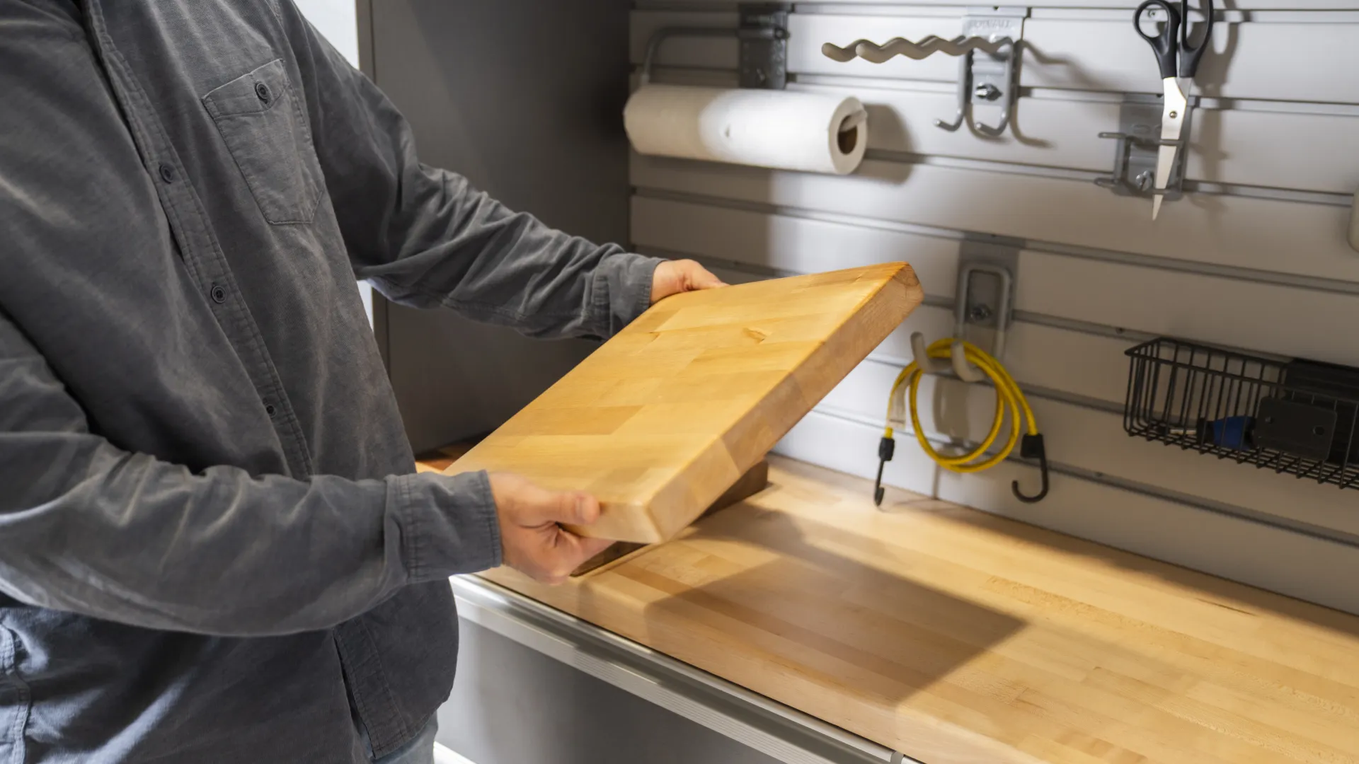 a man holding a wooden board