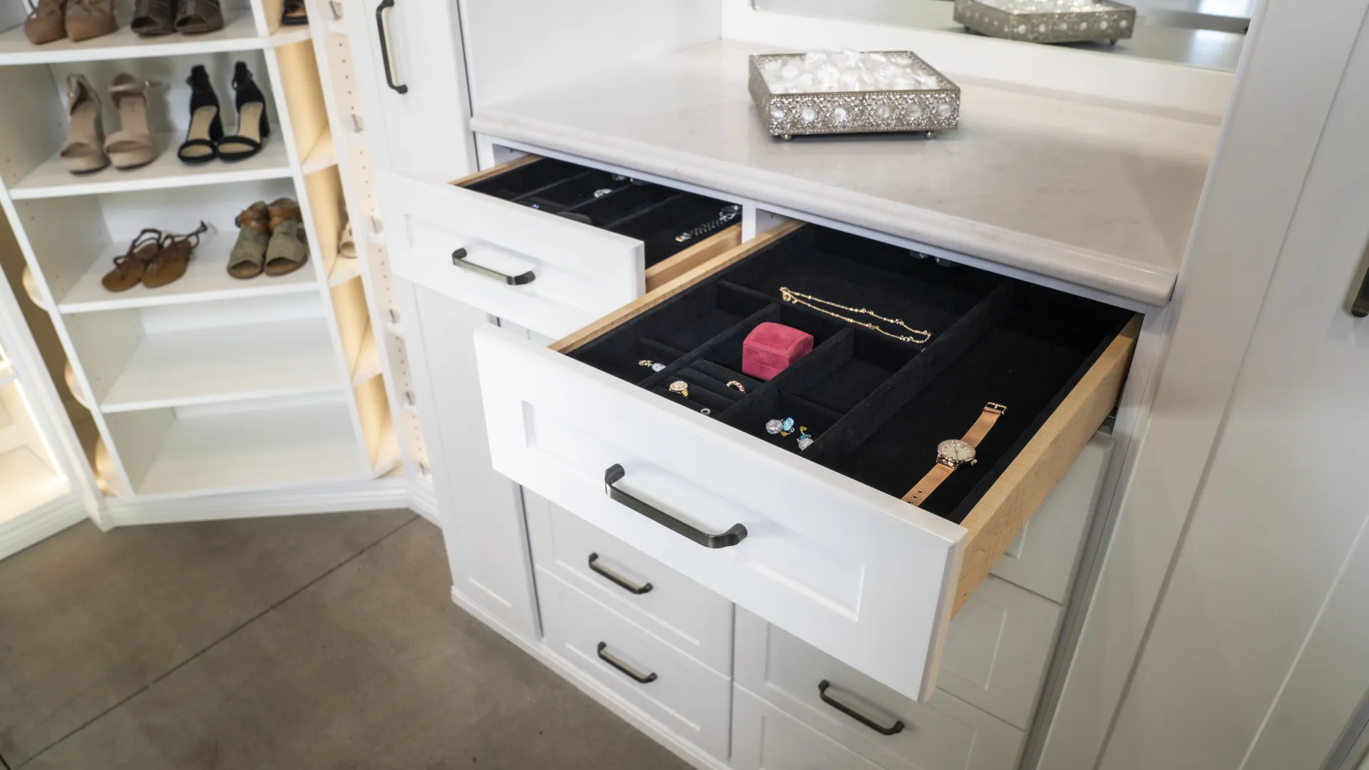 a white cabinet with shoes and shoes