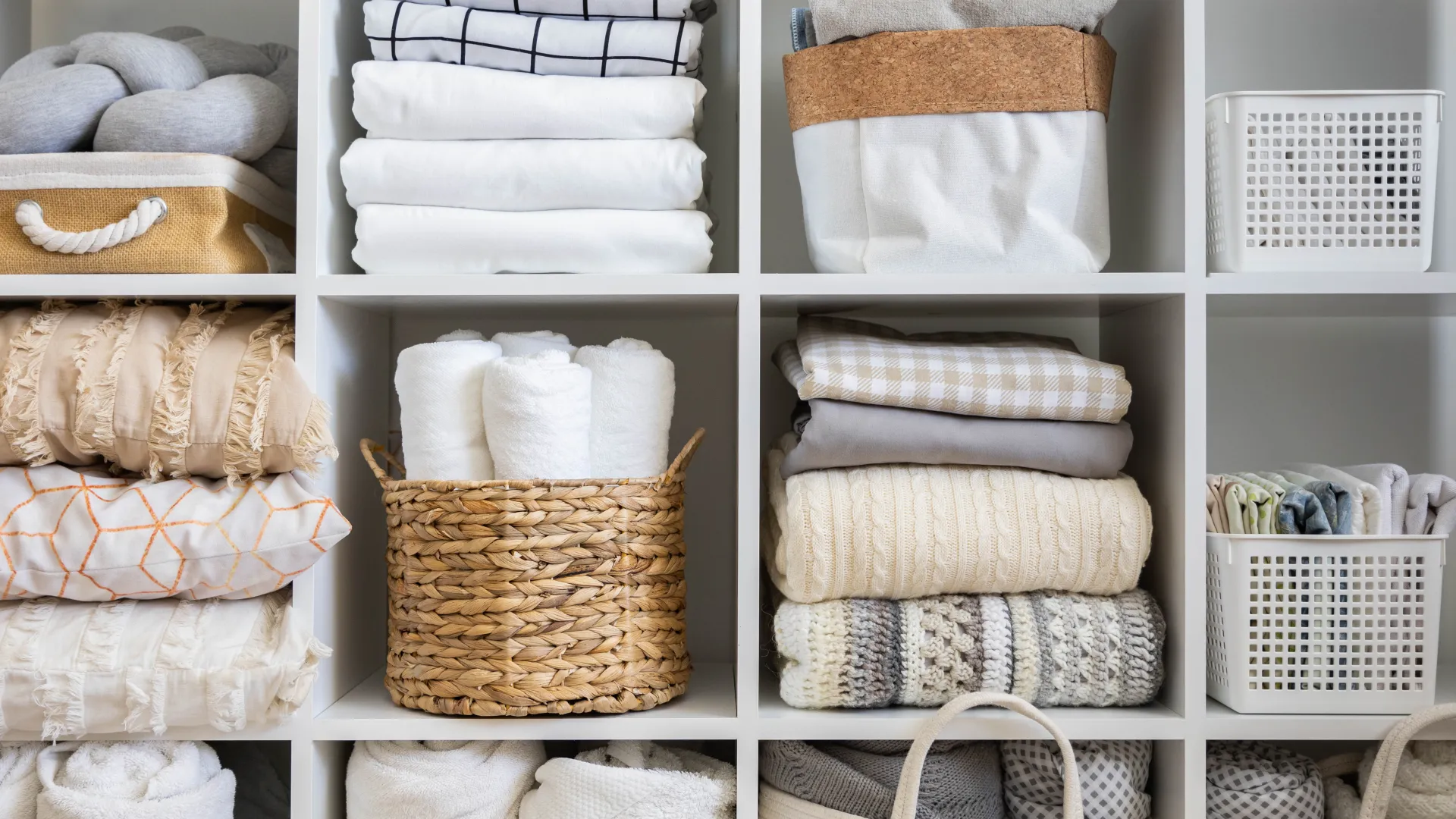 a group of baskets with white towels