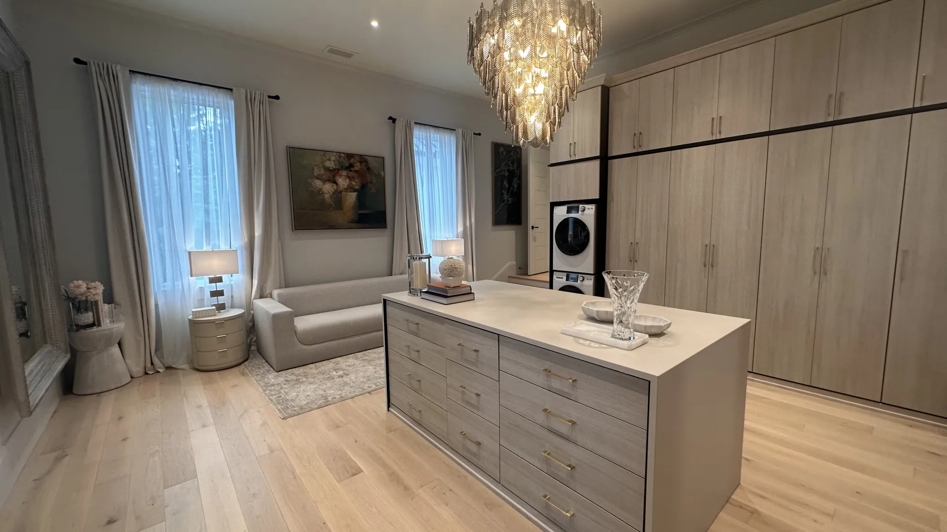 a large kitchen with a chandelier and a large wood floor