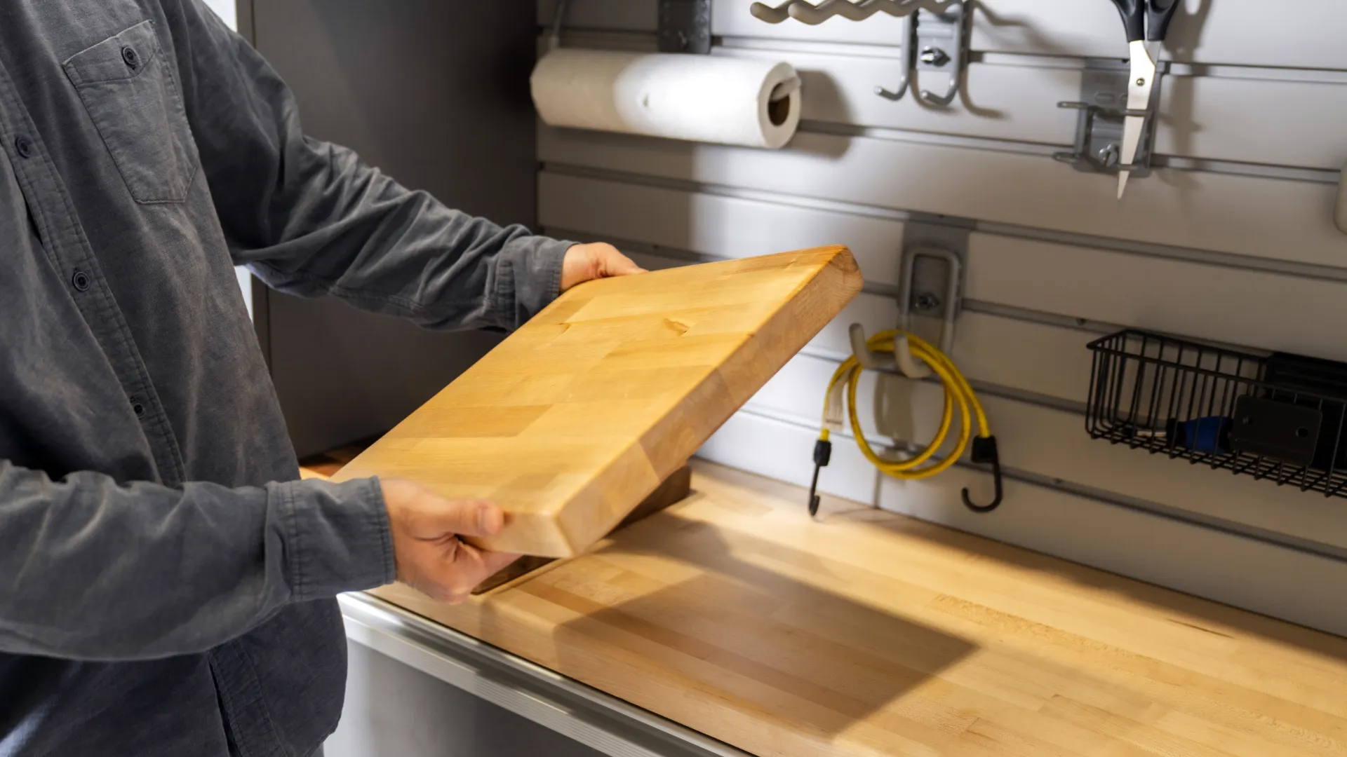 a man holding a wooden board