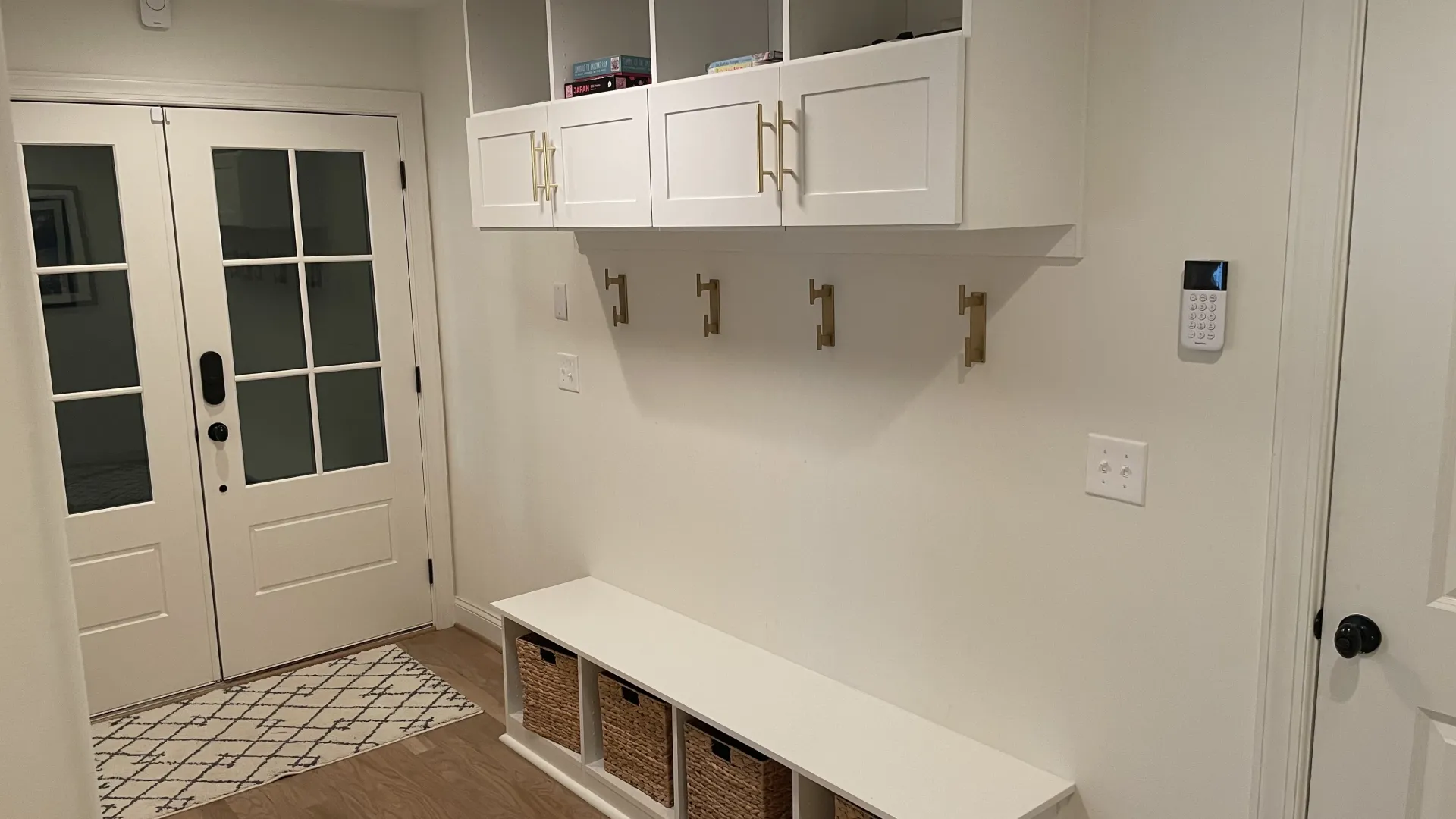 a kitchen with white cabinets