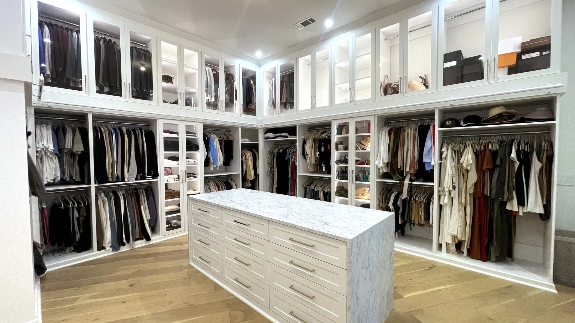 a white room with a white counter and white cabinets