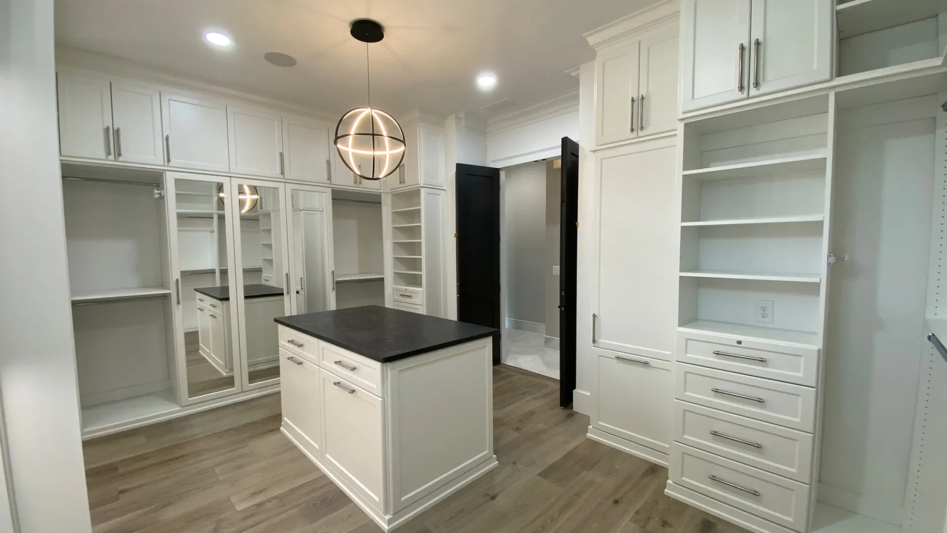 a kitchen with white cabinets