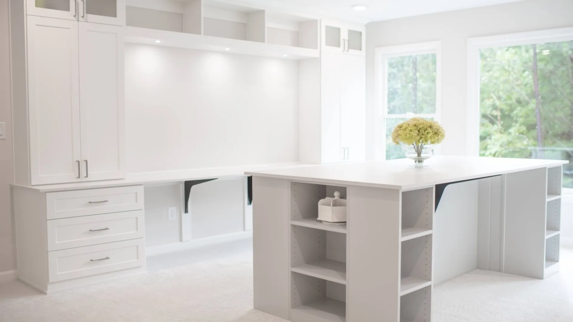 a white kitchen with white cabinets