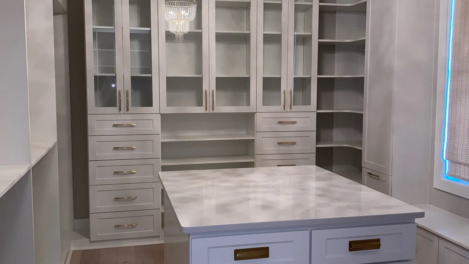 a kitchen with white cabinets