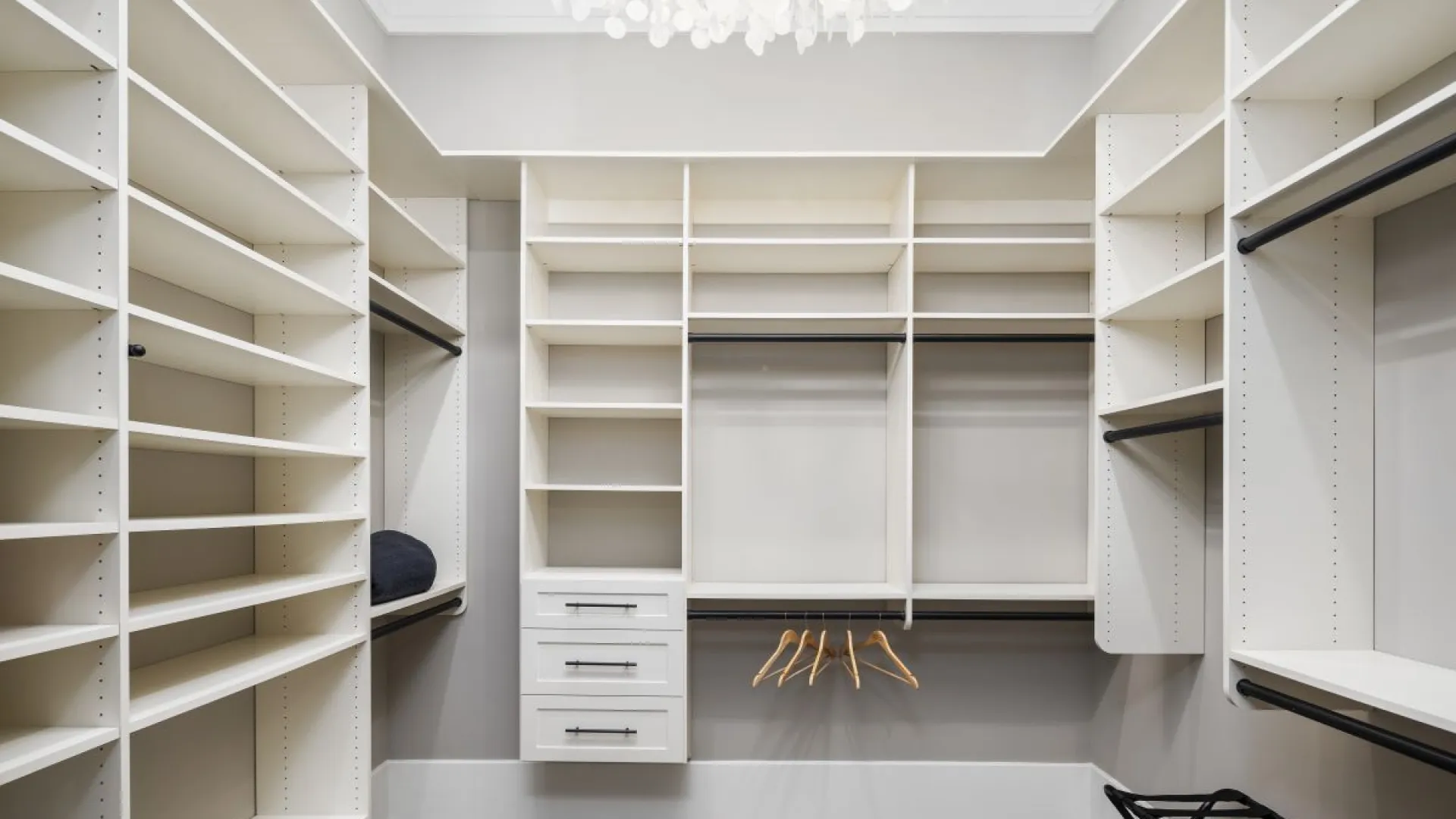 a room with white shelves