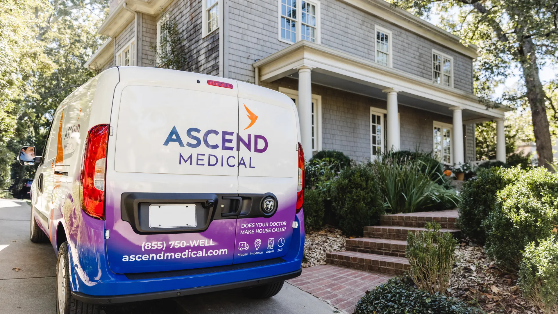 a van parked in front of a house