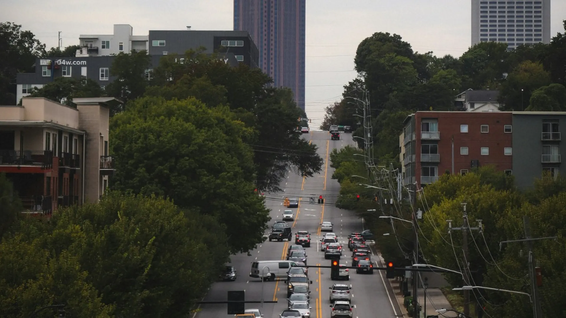 a city street with cars and buildings