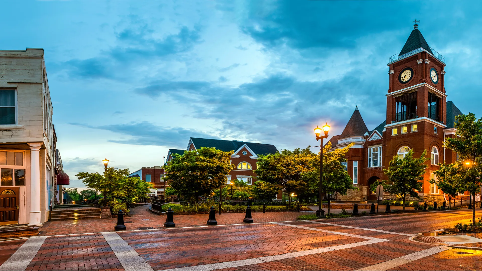 a brick courtyard with a clock tower