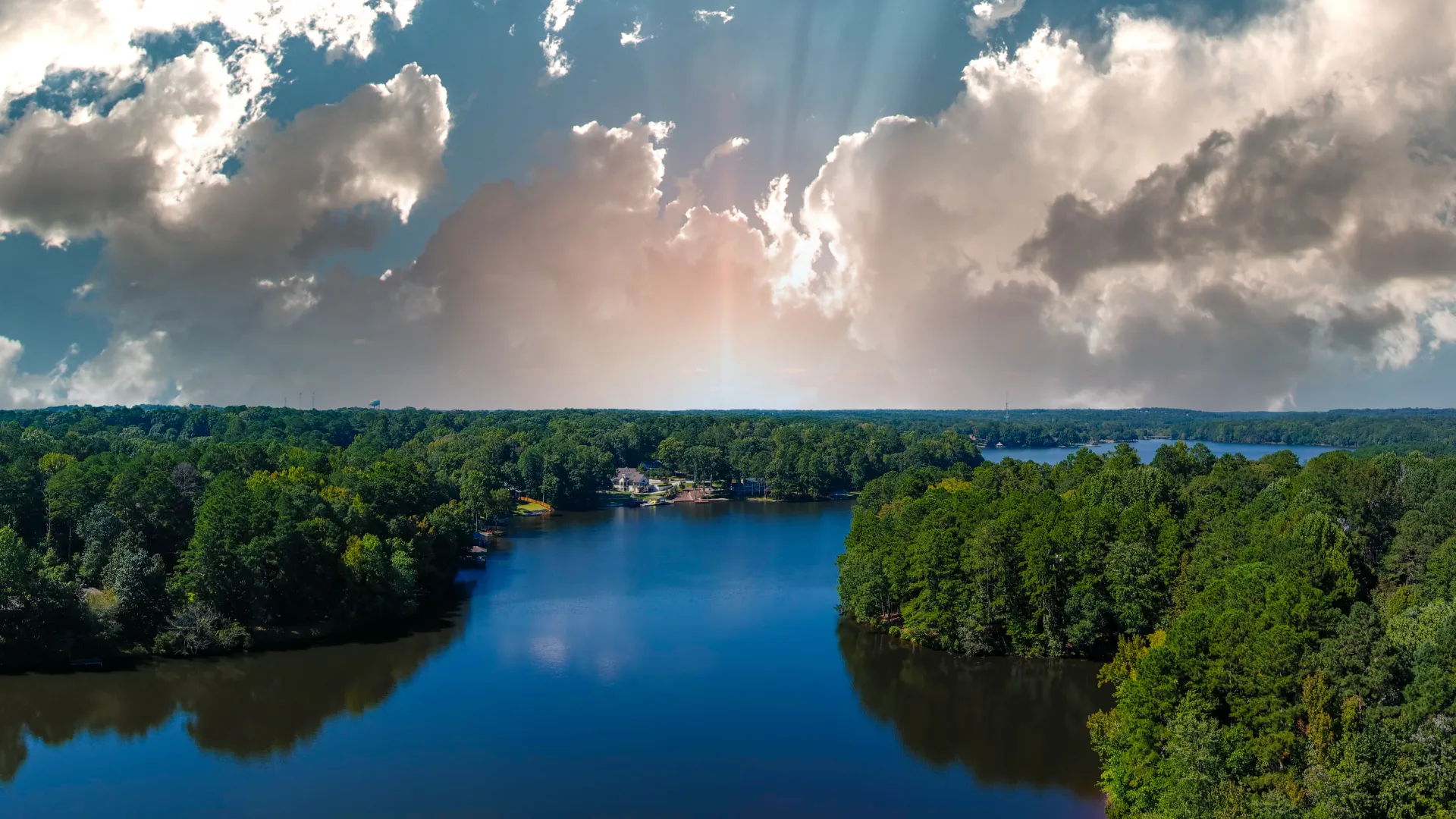 a body of water surrounded by trees