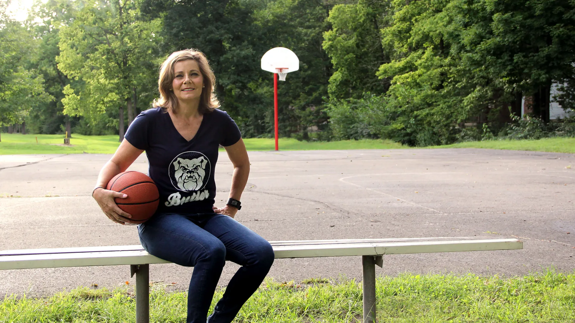 a person sitting on a bench with a frisbee