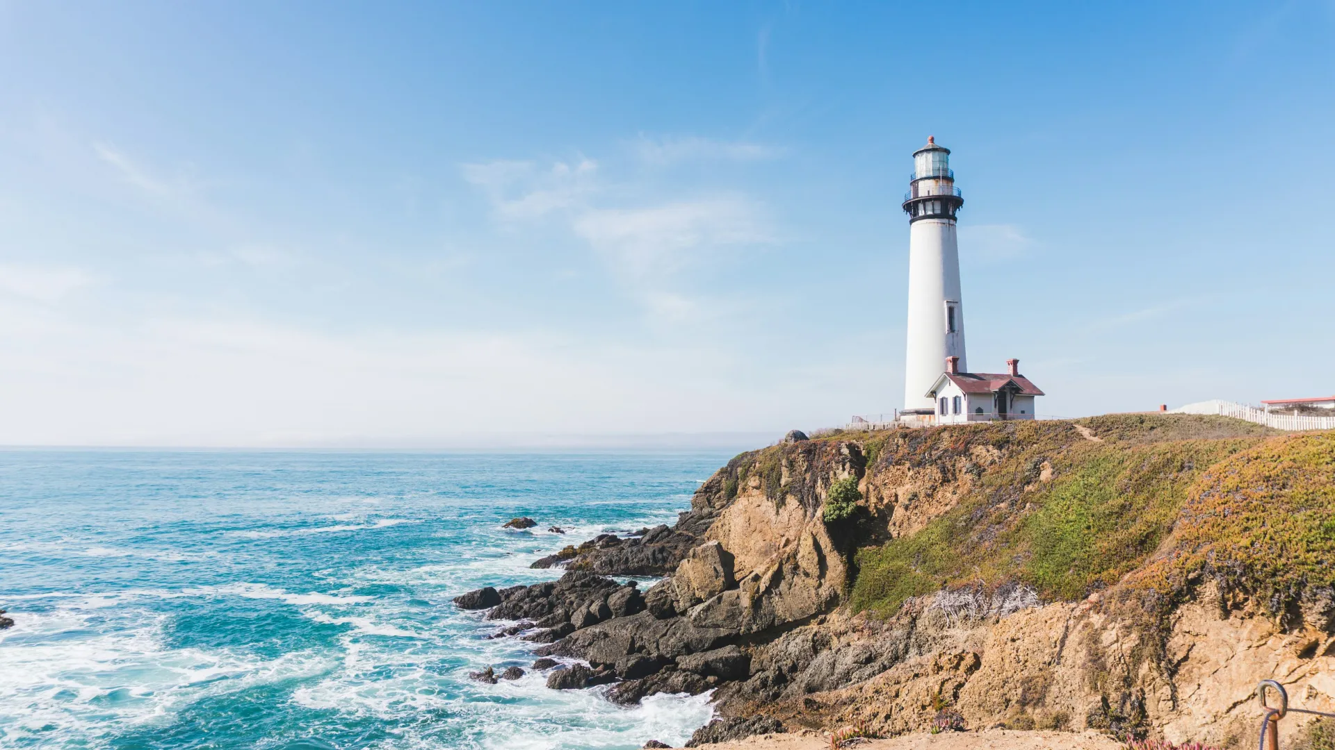 a lighthouse on a rocky cliff