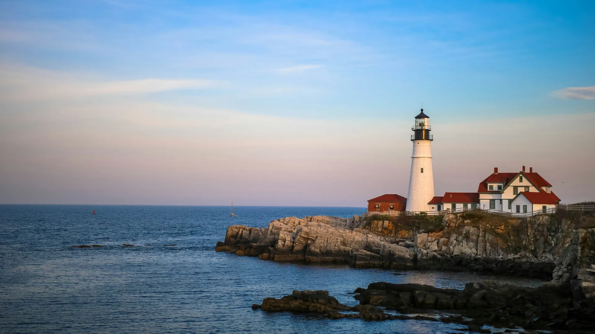 a lighthouse on a rocky island