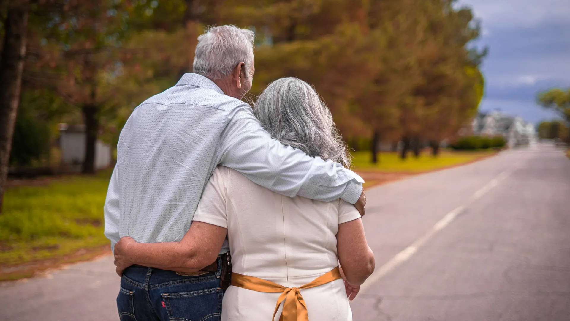 a man and woman holding each other