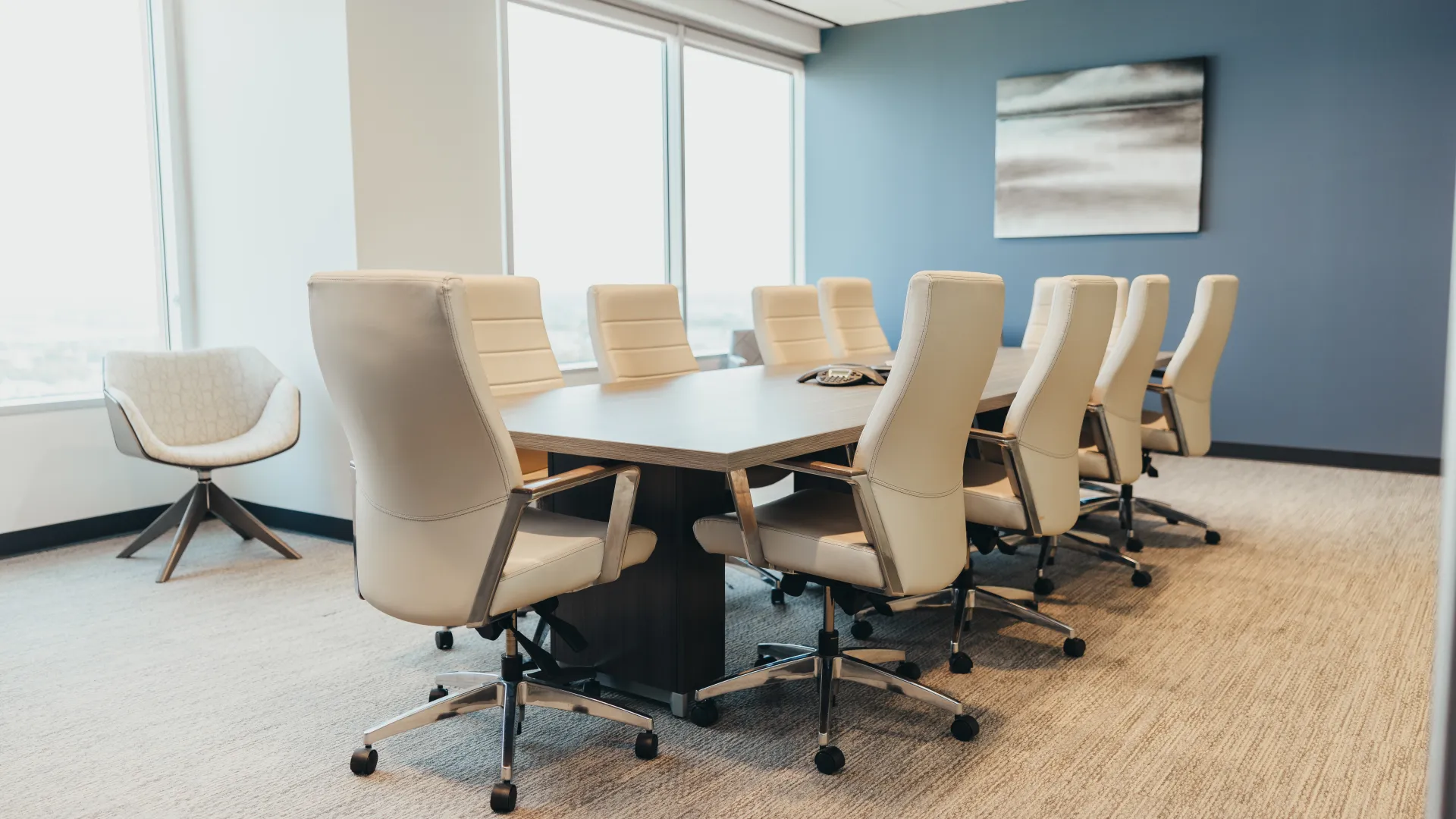 a conference room with a table and chairs