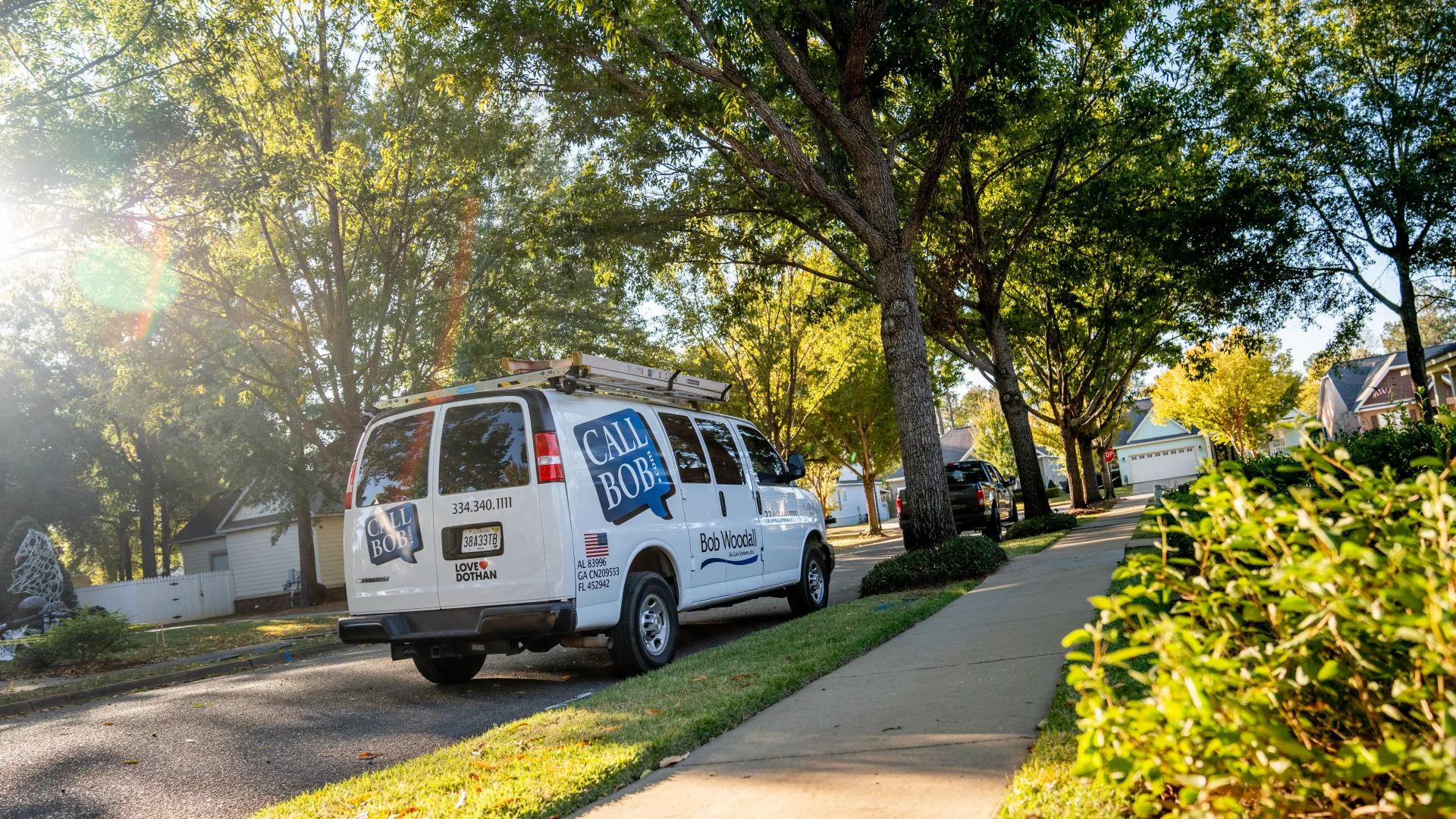 a white van parked on the side of a road