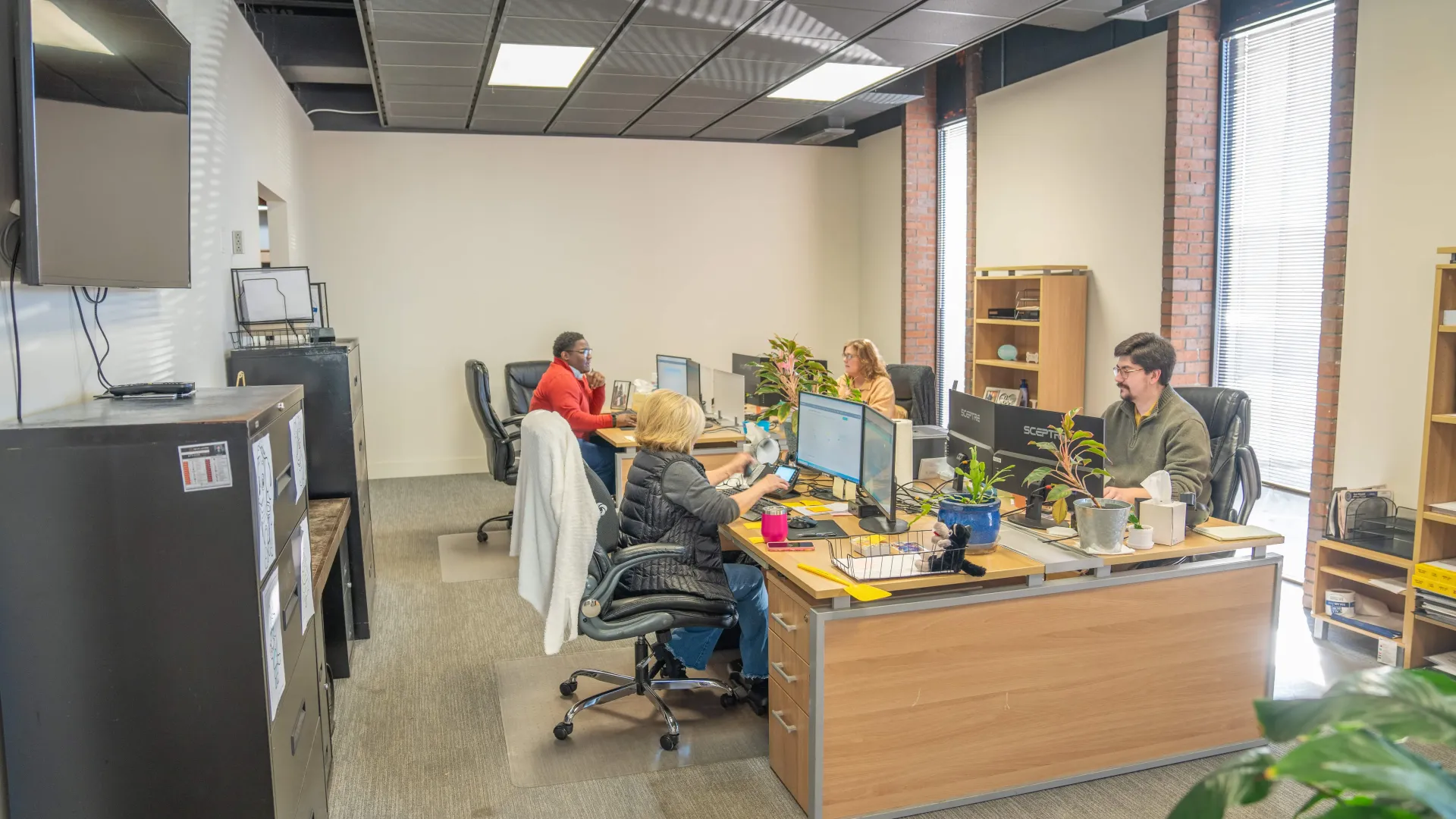 a group of people working in an office