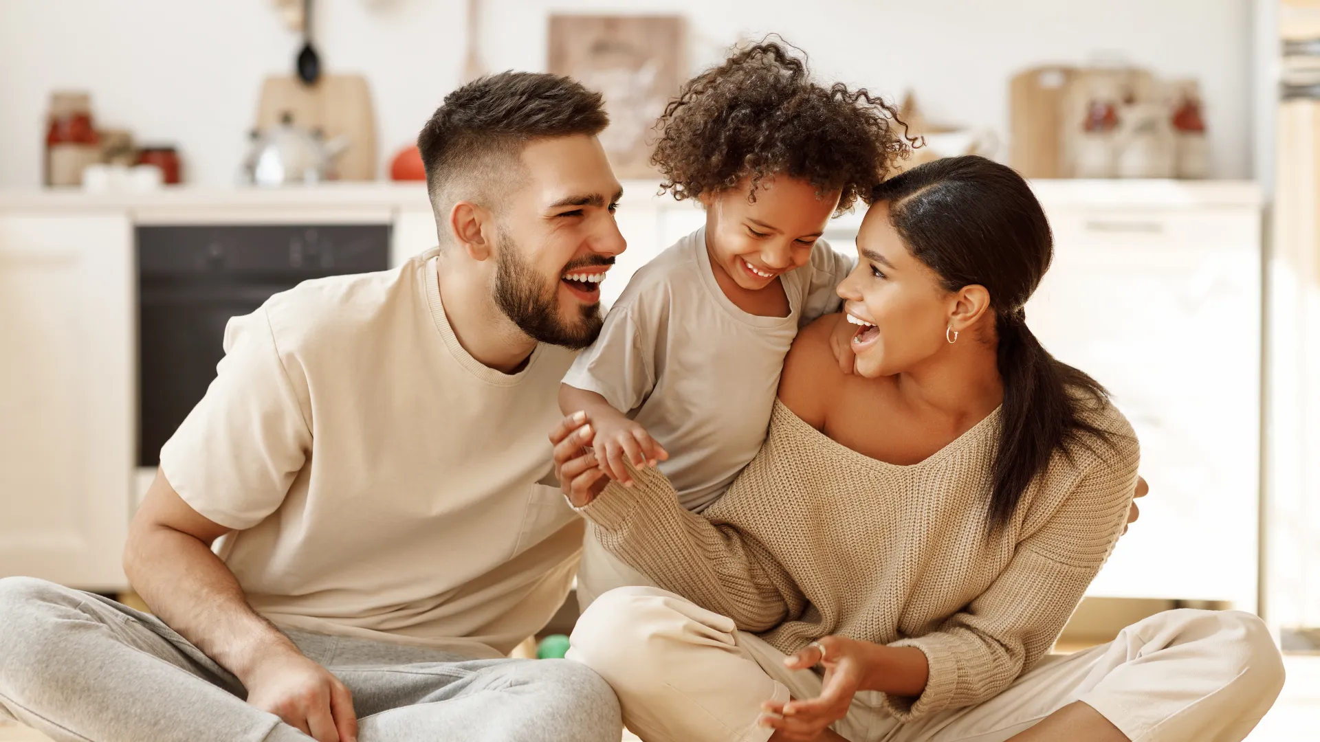 a family sitting on the floor