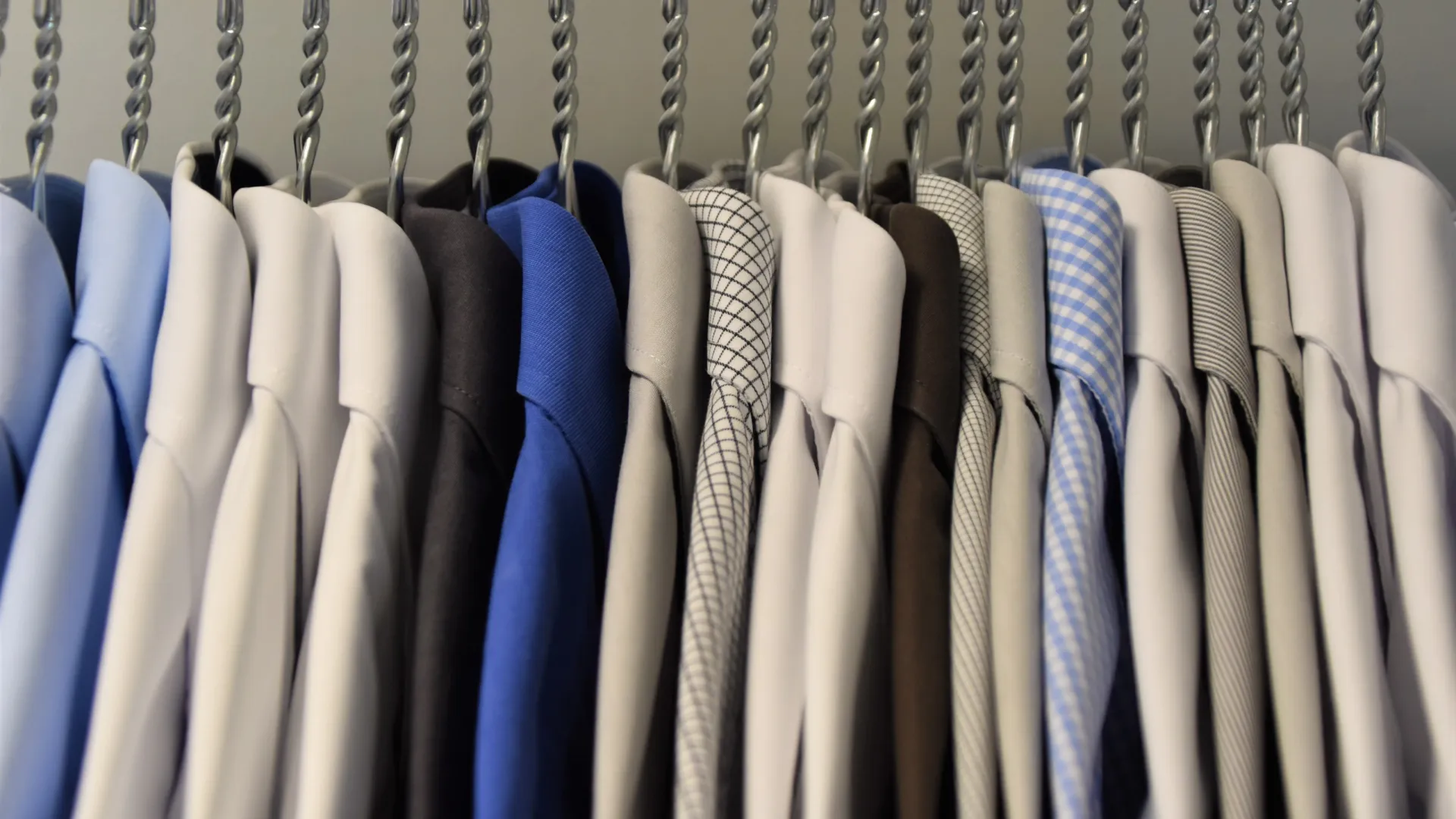 a row of white and blue shirts