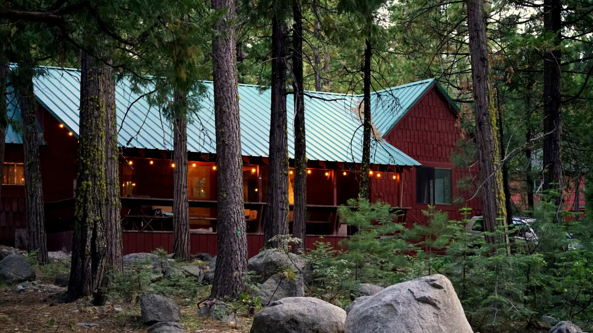 a house with trees and rocks