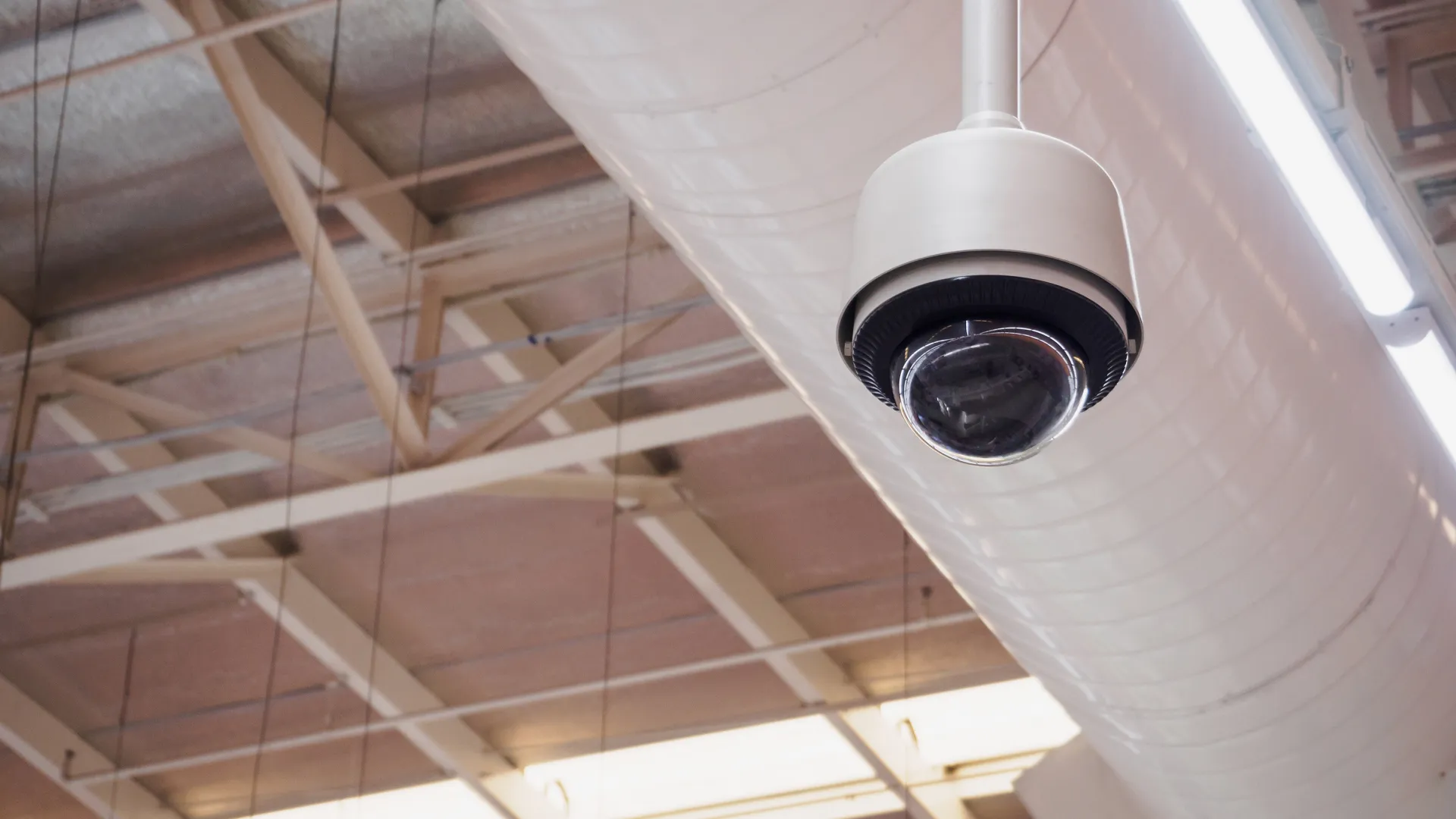 security camera attached to industrial ceiling