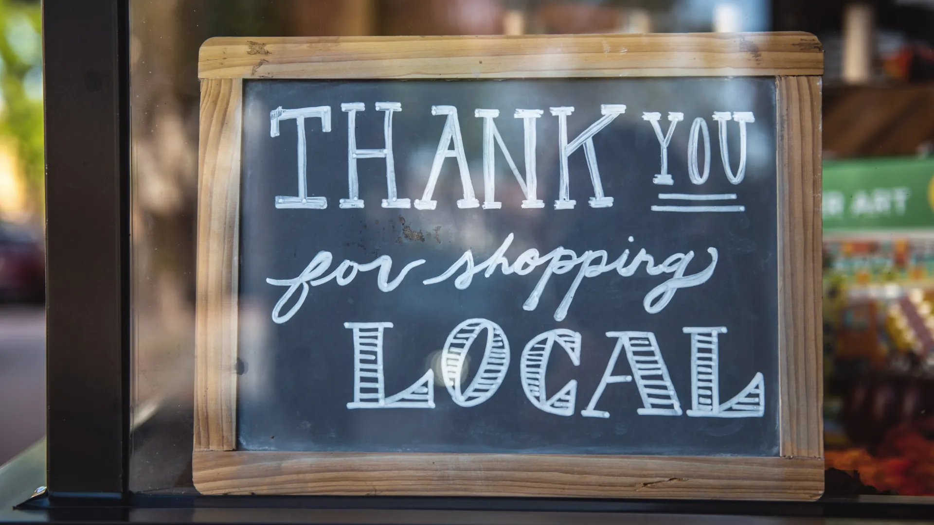 a sign on a wooden surface