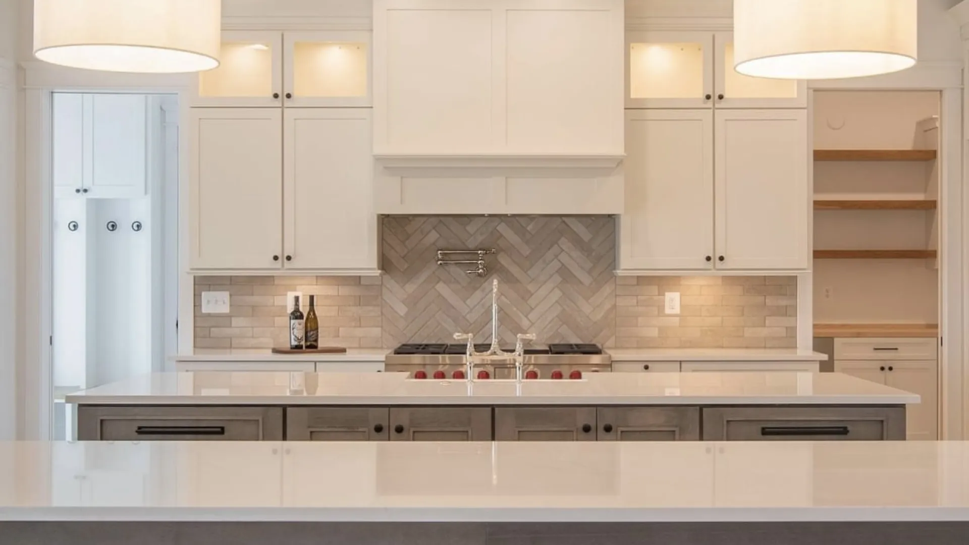 a kitchen with white cabinets