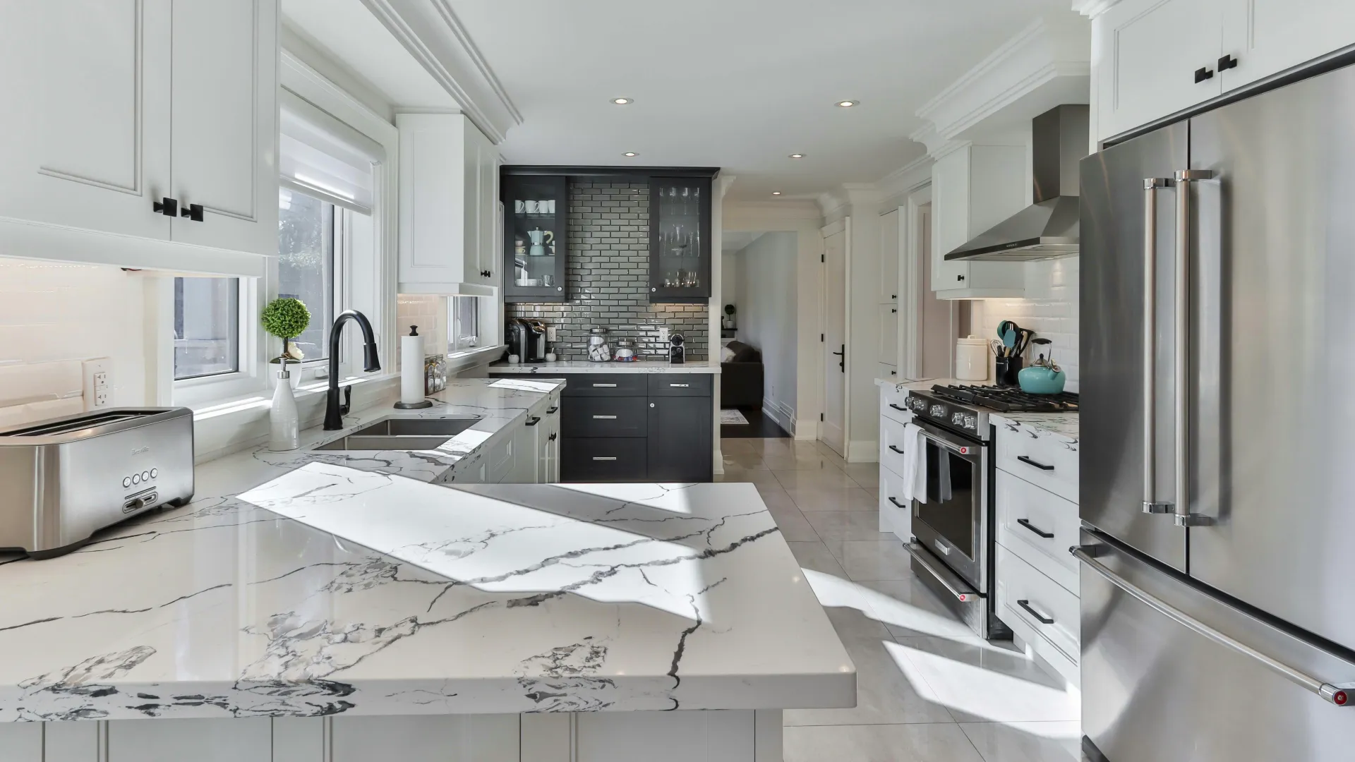 a kitchen with white cabinets