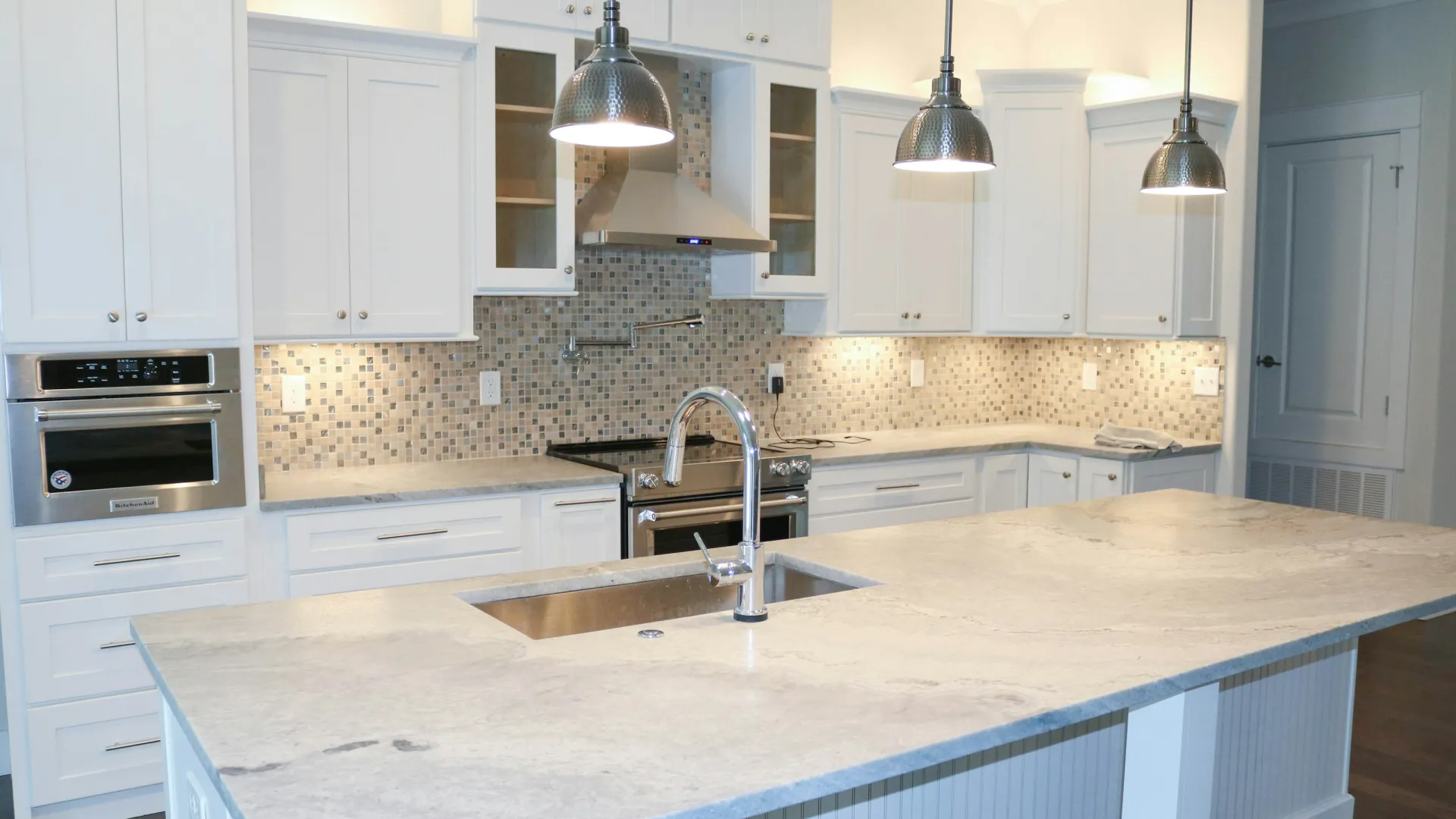 a kitchen with white cabinets