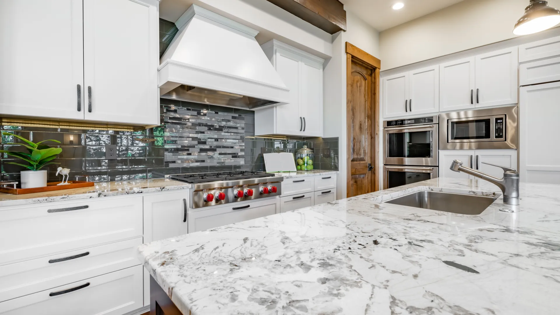 a kitchen with white cabinets