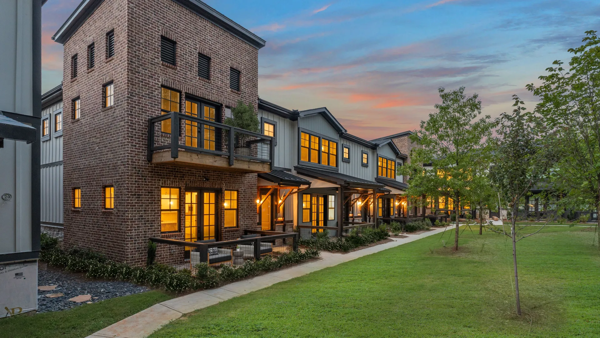 a building with a lawn and trees