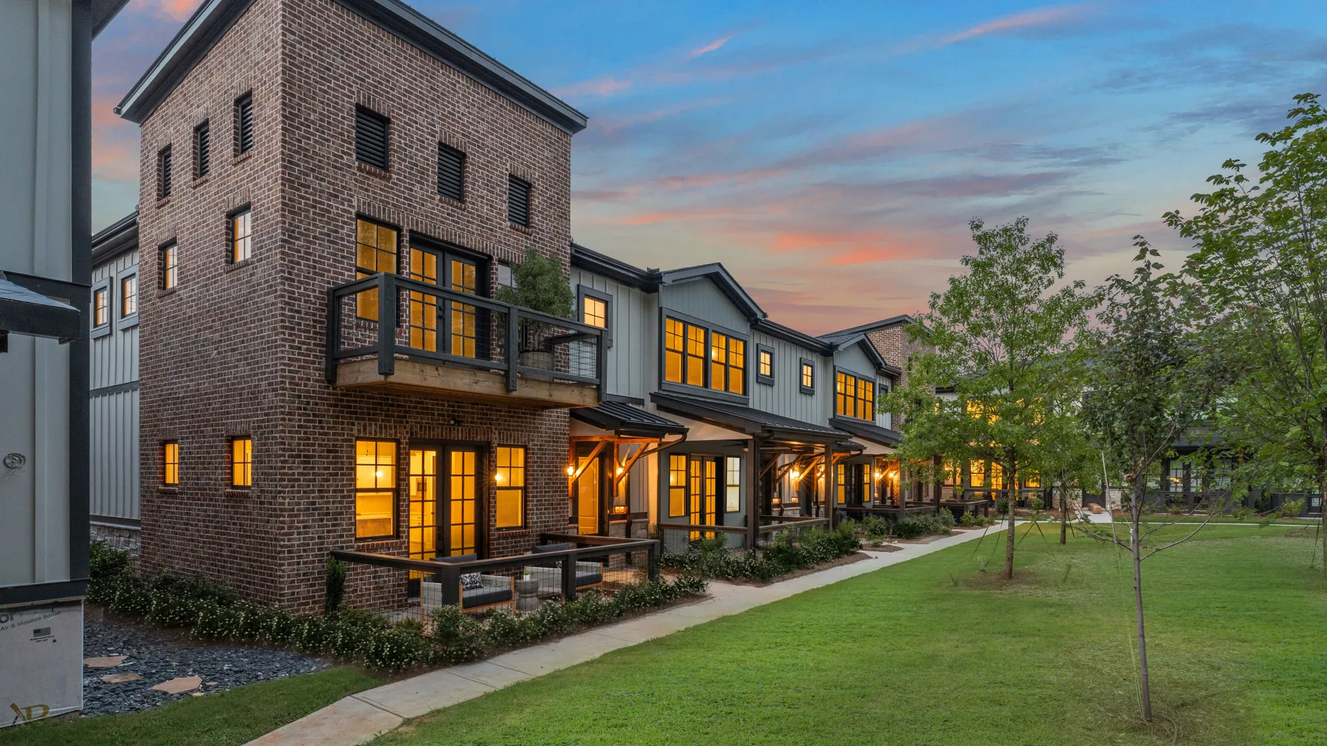 a building with a lawn and trees