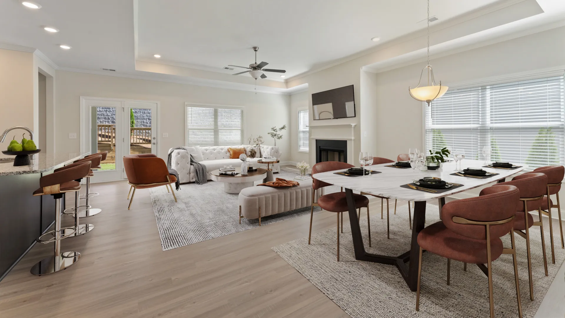 a large living room with a dining table and chairs