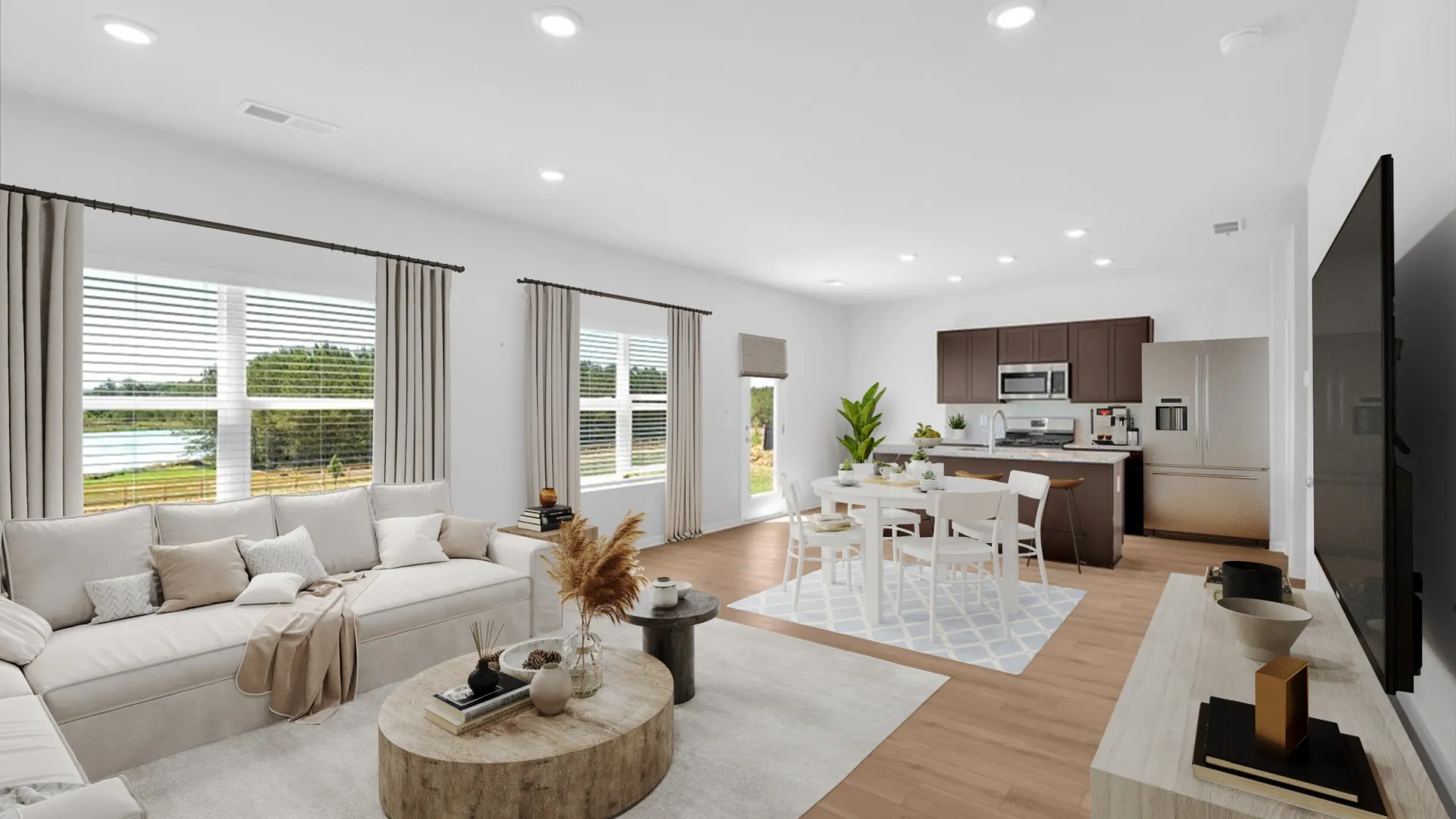 Modern living room with blue accents, hardwood floors, and bright natural light.