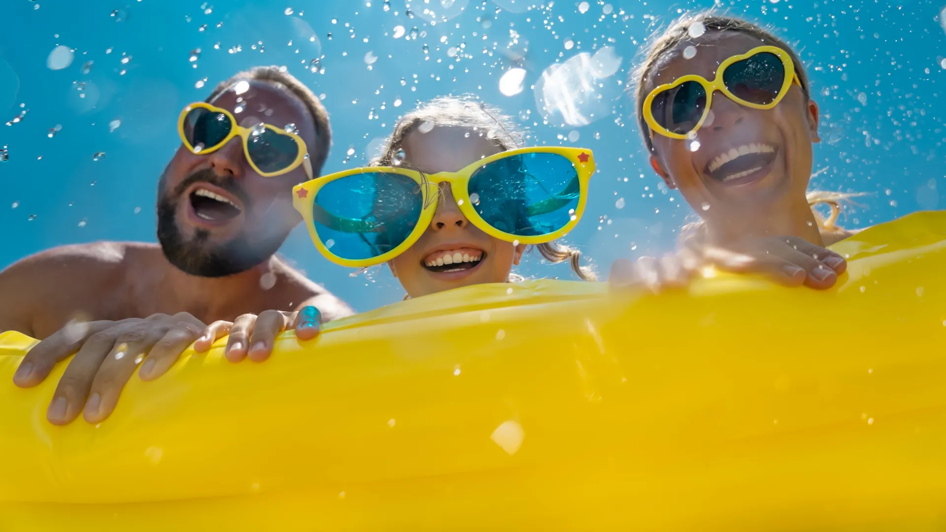 a group of people in a pool wearing goggles
