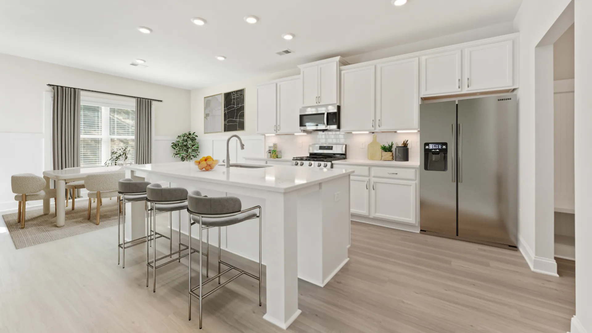 a kitchen with white cabinets