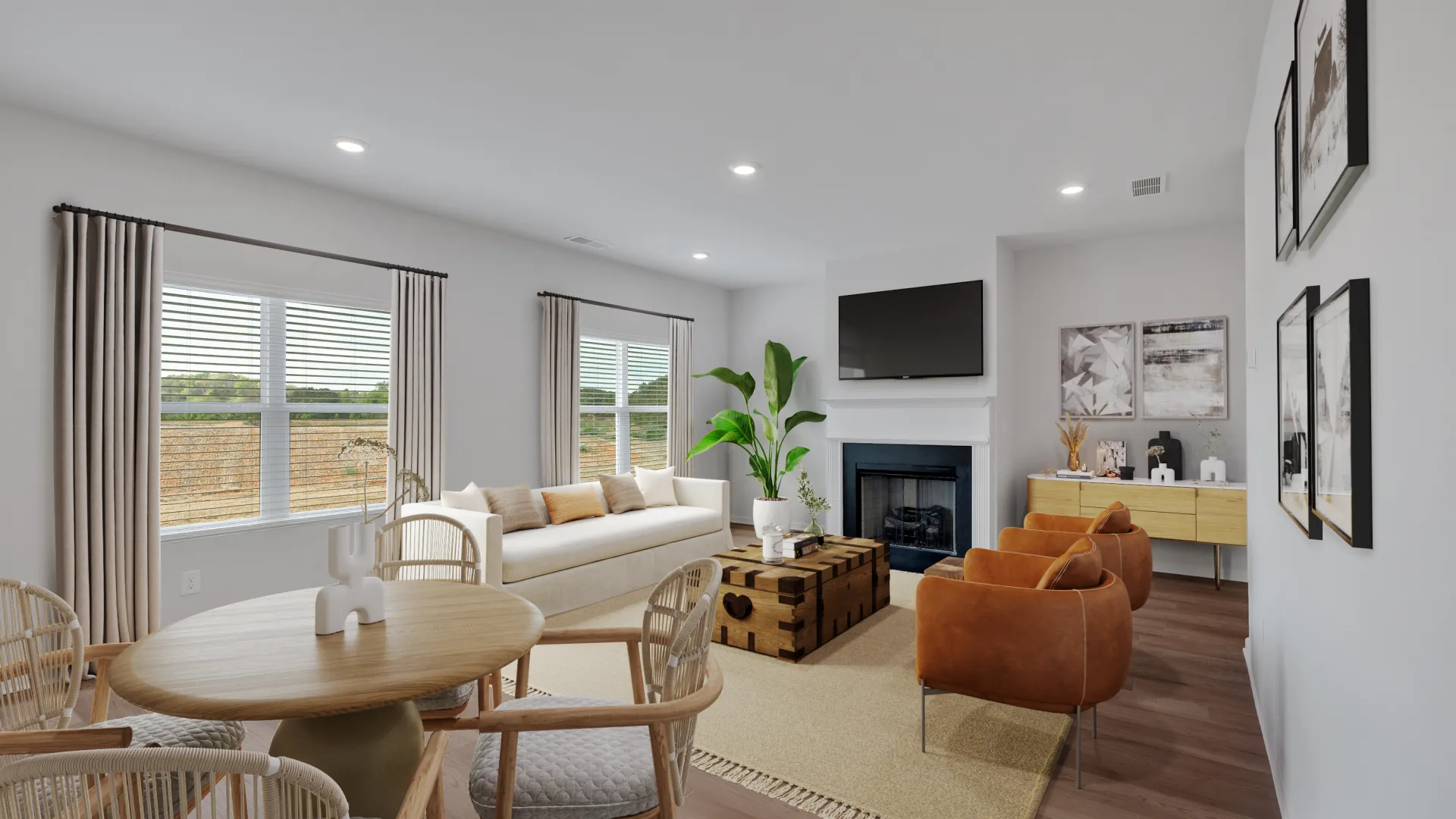 Modern living room with blue accents, hardwood floors, and bright natural light.