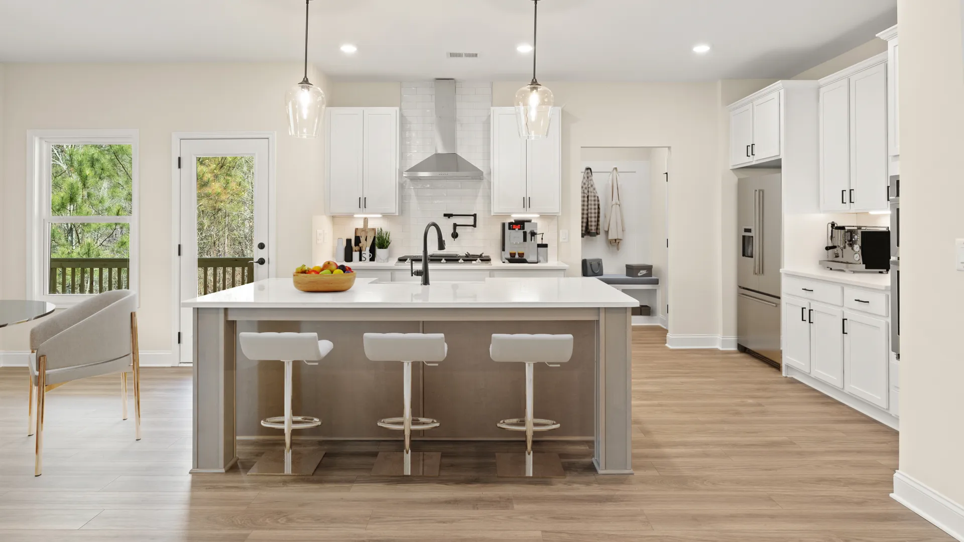 a kitchen with white cabinets