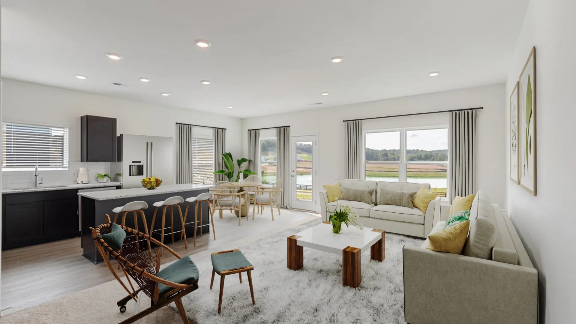Bright open concept living room and kitchen with modern furniture and large windows overlooking a scenic view.