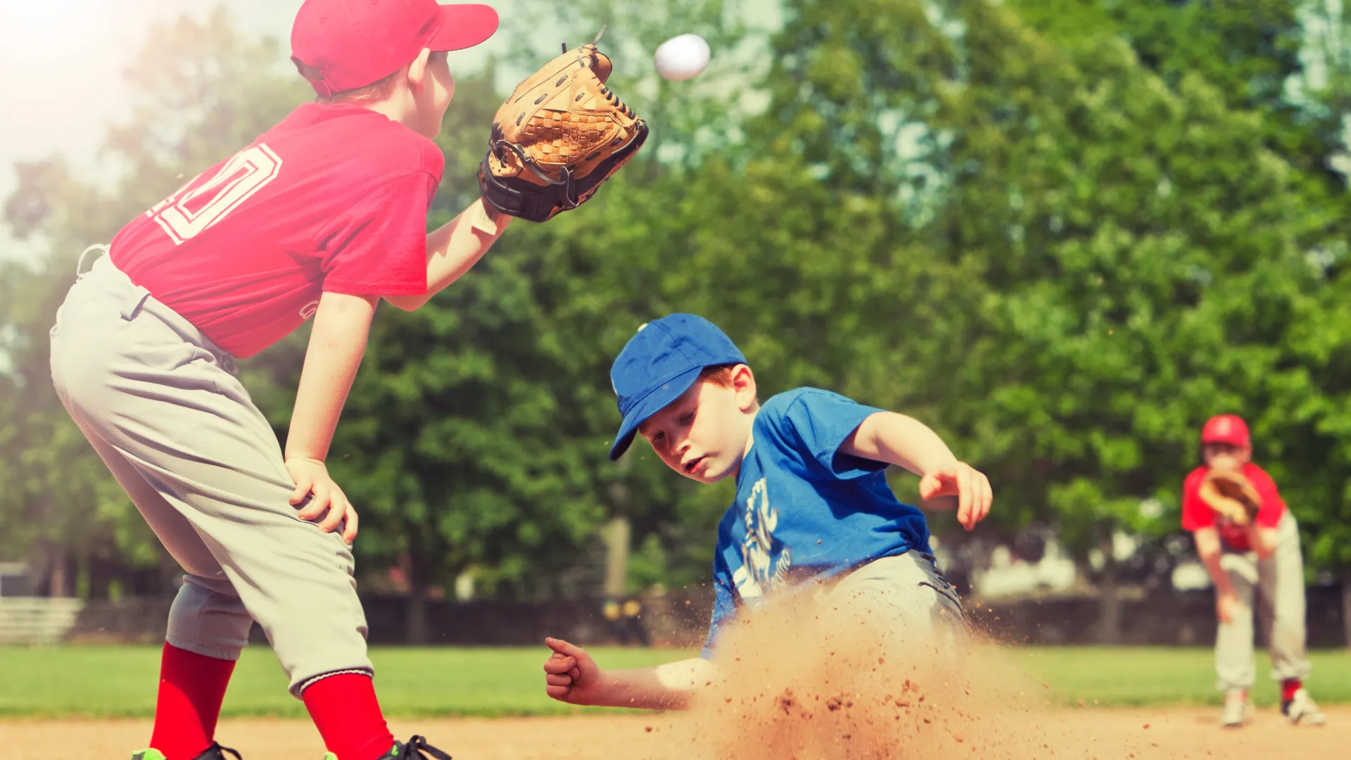 a couple of kids playing baseball