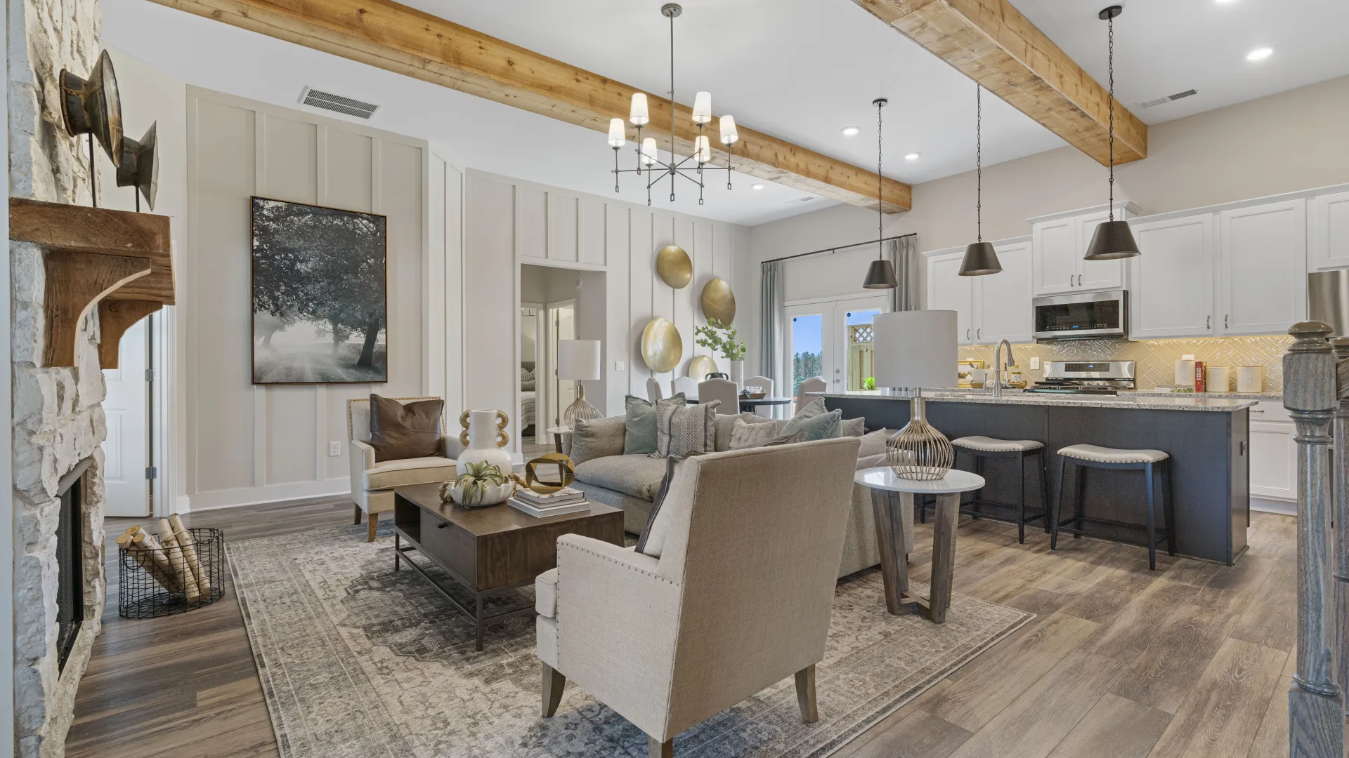 a large living room with a bar and chairs