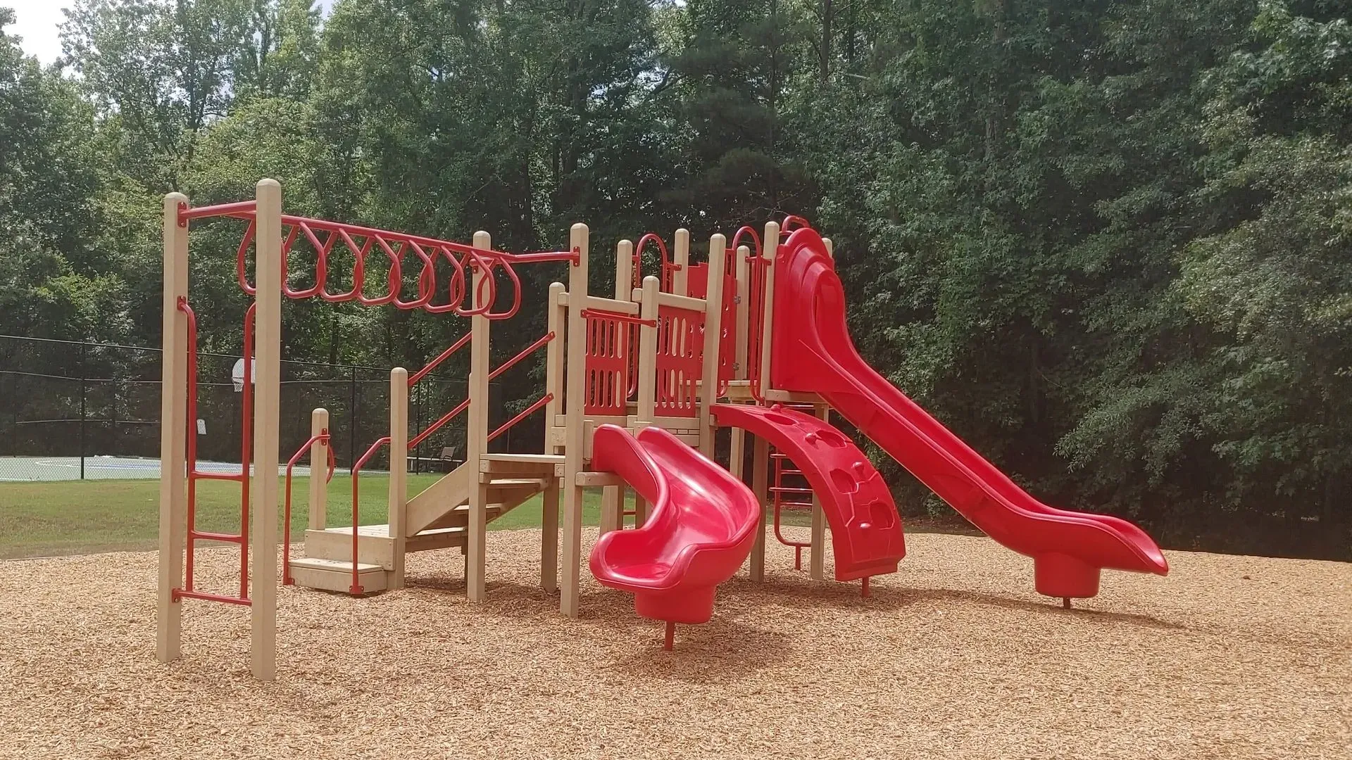 a playground with red slide