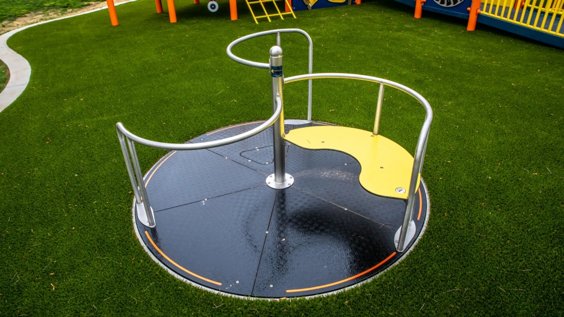 a small trampoline on a grass field