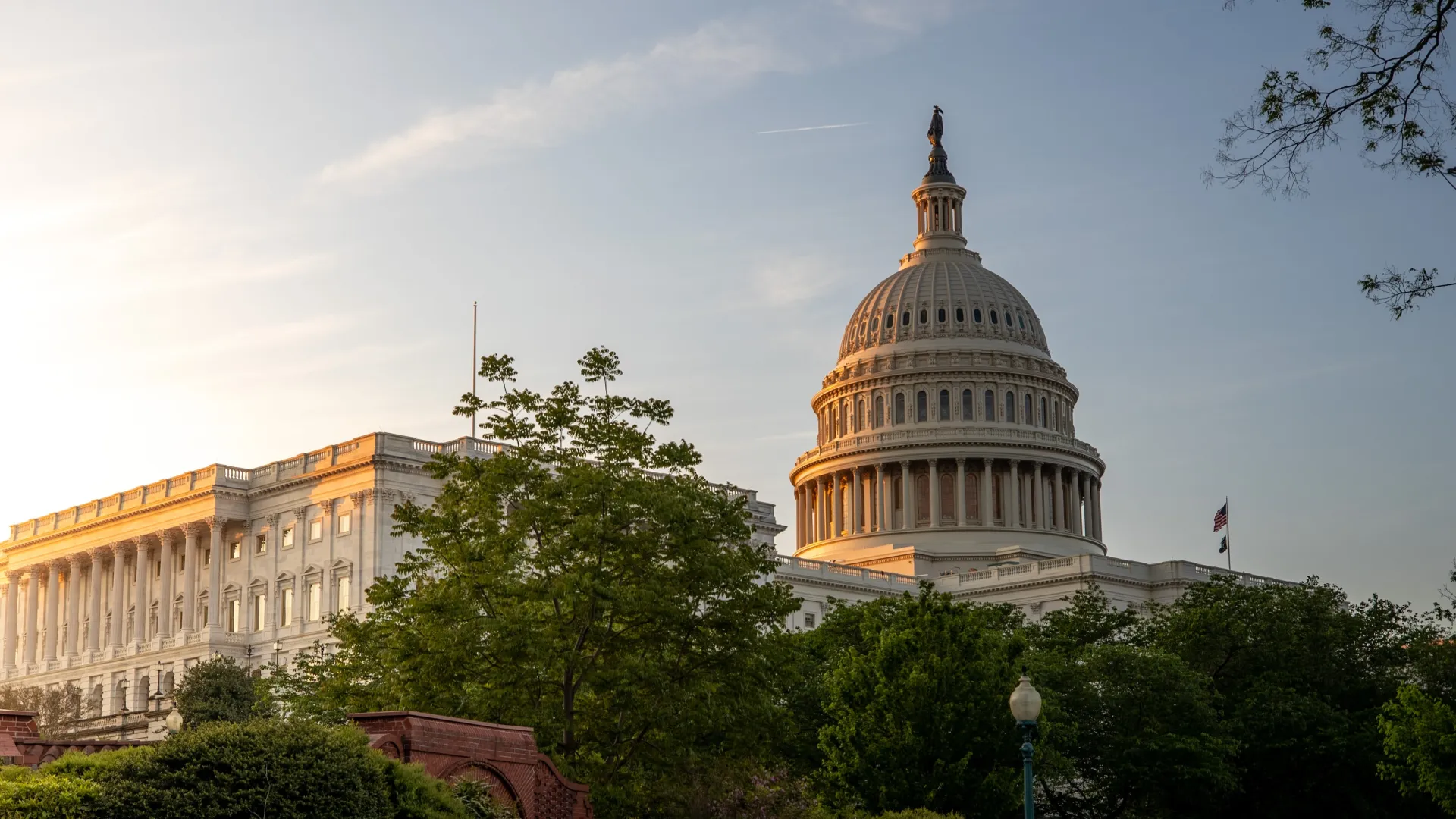 a large building with a domed roof with United States Capitol in the background