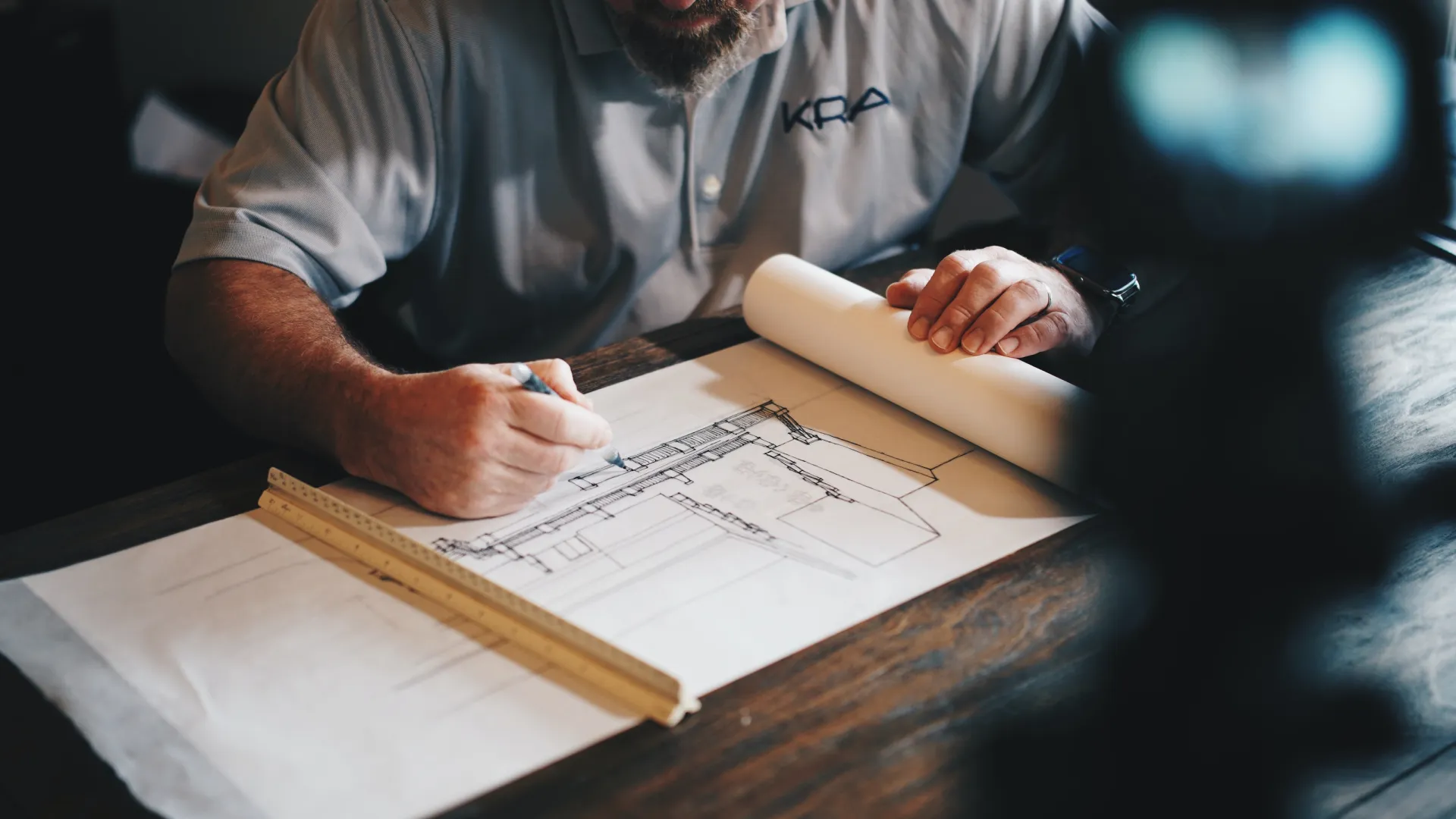 a man writing on a piece of paper