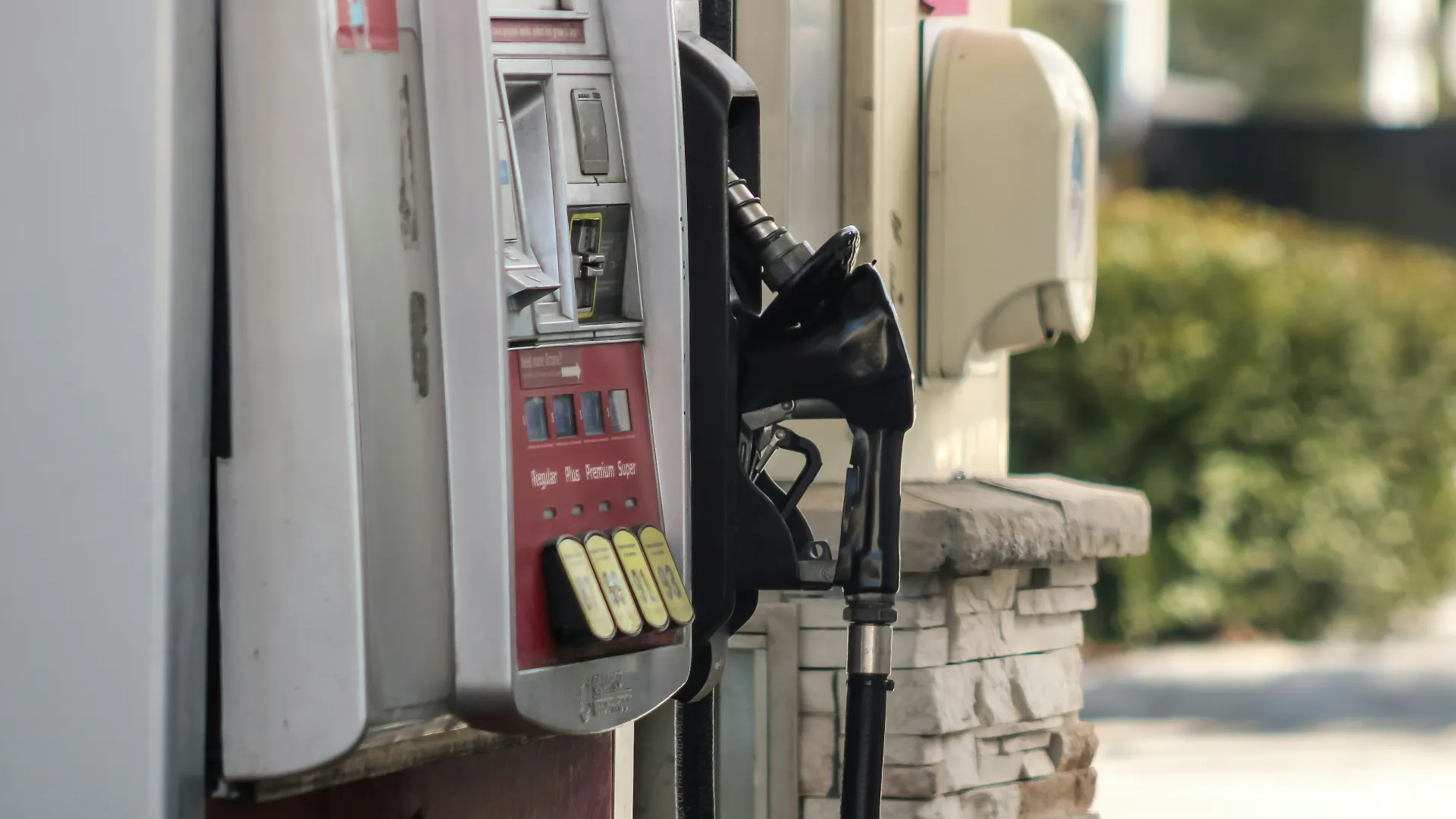 a pay phone on a sidewalk