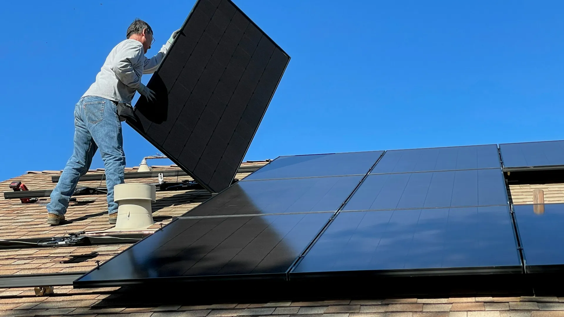 a man standing on a roof