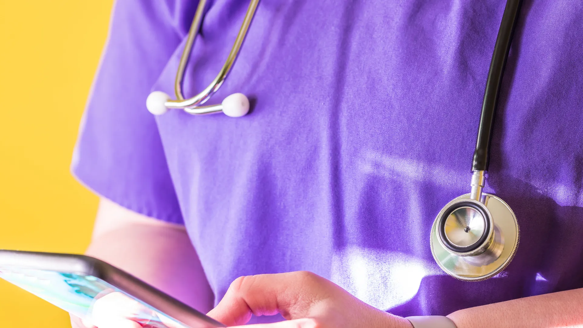 a close-up of a person's hand holding a stethoscope